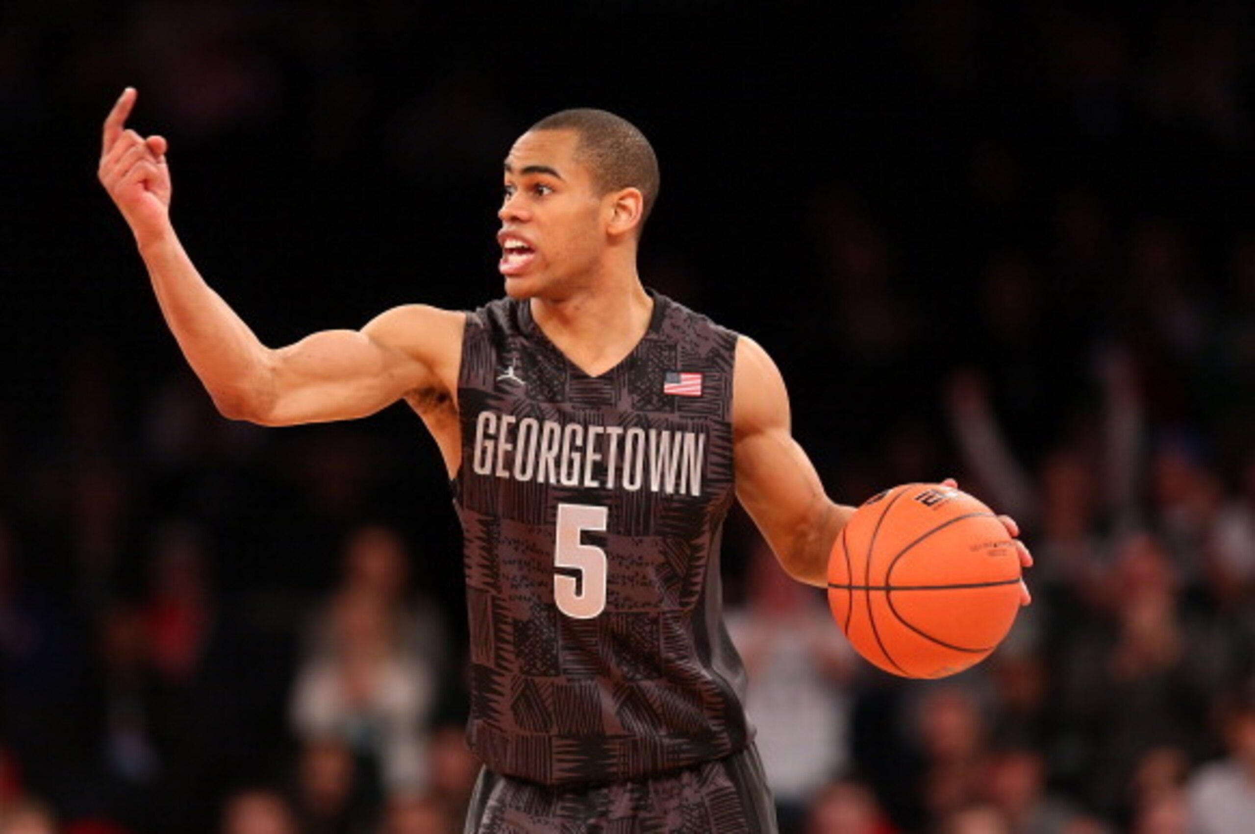NEW YORK, NY - FEBRUARY 01:  Markel Starks #5 of the Georgetown Hoyas signals to teamates as he takes the ball down the court against the Michigan State Spartans during the game at Madison Square Garden on February 1, 2014 in New York City.  (Photo by Nat