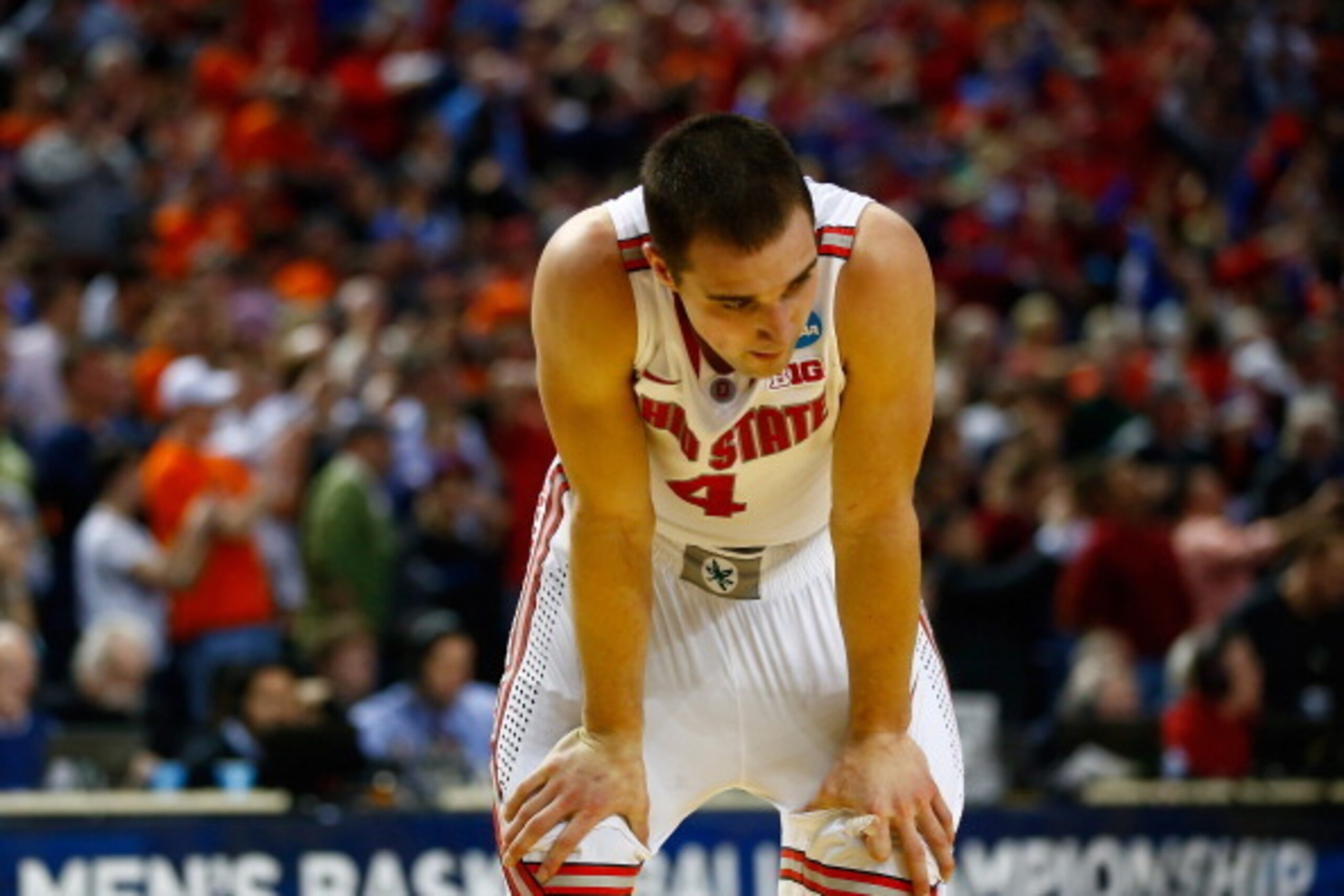 BUFFALO, NY - MARCH 20:  Aaron Craft #4 of the Ohio State Buckeyes reacts after losing to the Dayton Flyers 60-59 in the second round of the 2014 NCAA Men's Basketball Tournament at the First Niagara Center on March 20, 2014 in Buffalo, New York.  (Photo 
