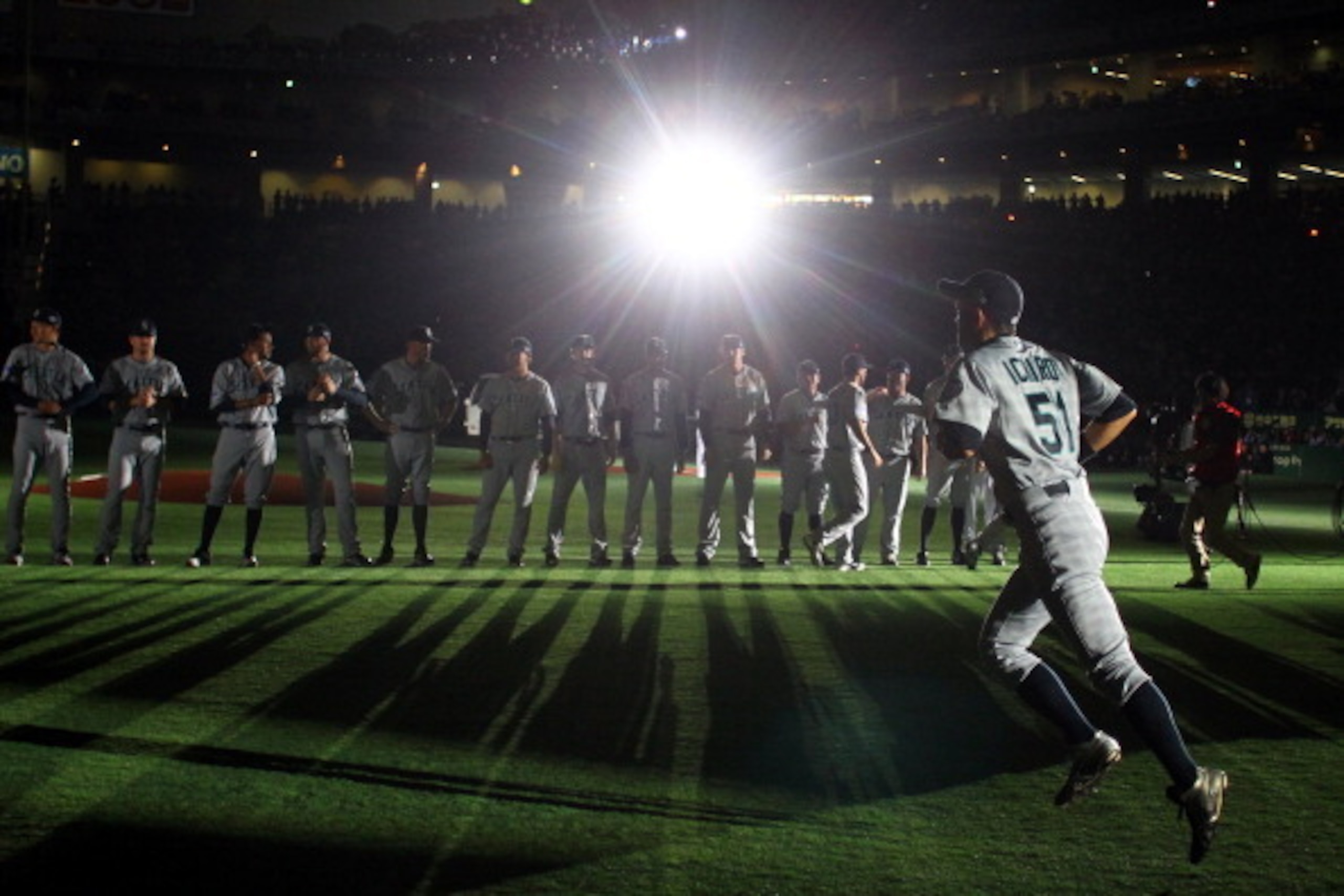 TOKYO, JAPAN - MARCH 29: Outfielder Ichiro Suzuki (R) of Seattle Mariners runs to line up for national anthem during MLB match between Seattle Mariners and Oakland Athletics at Tokyo Dome on March 29, 2012 in Tokyo, Japan.  (Photo by Koji Watanabe/Getty I