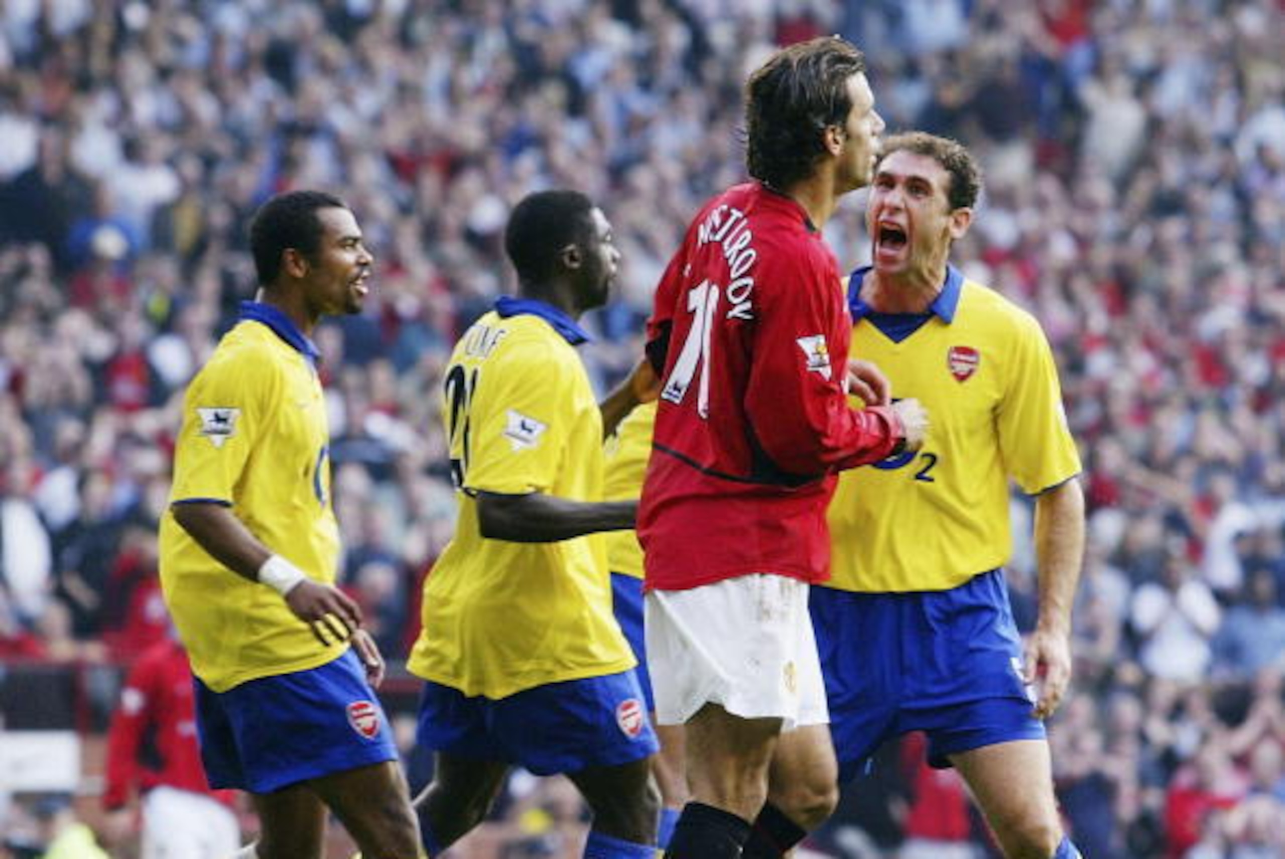 MANCHESTER, ENGLAND - SEPTEMBER 21:  Martin Keown of Arsenal shows his feelings at Ruud Van Nistelrooy of Man Utd after Van Nistelrooy missed his penalty during the FA Barclaycard Premiership match between Manchester United and Arsenal at Old Trafford on 