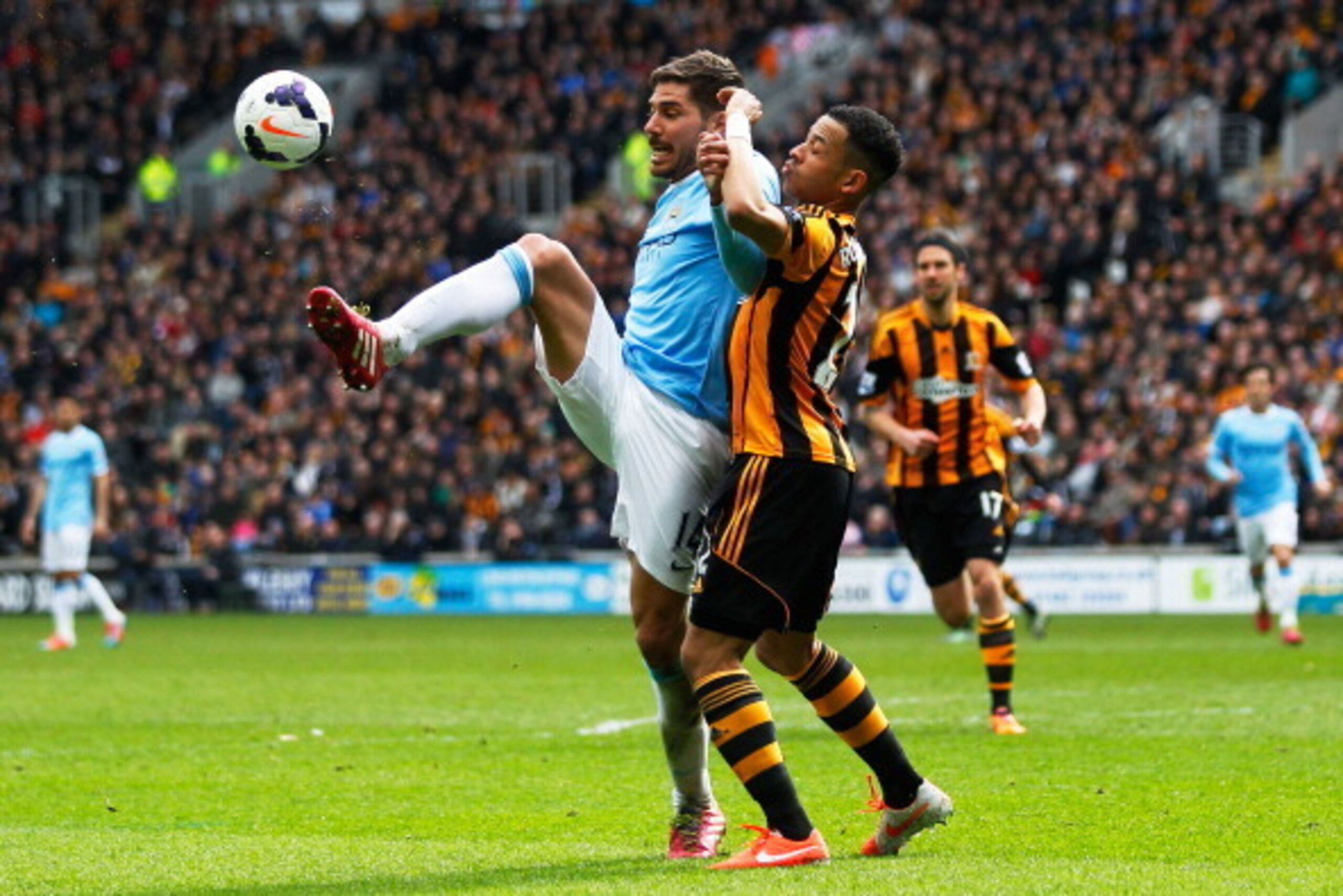 HULL, ENGLAND - MARCH 15:  Javi Garcia of Manchester City is challenged by Liam Rosenior of Hull City during the Barclays Premier league match between Hull City and Manchester City at KC Stadium on March 15, 2014 in Hull, England.  (Photo by Paul Thomas/G