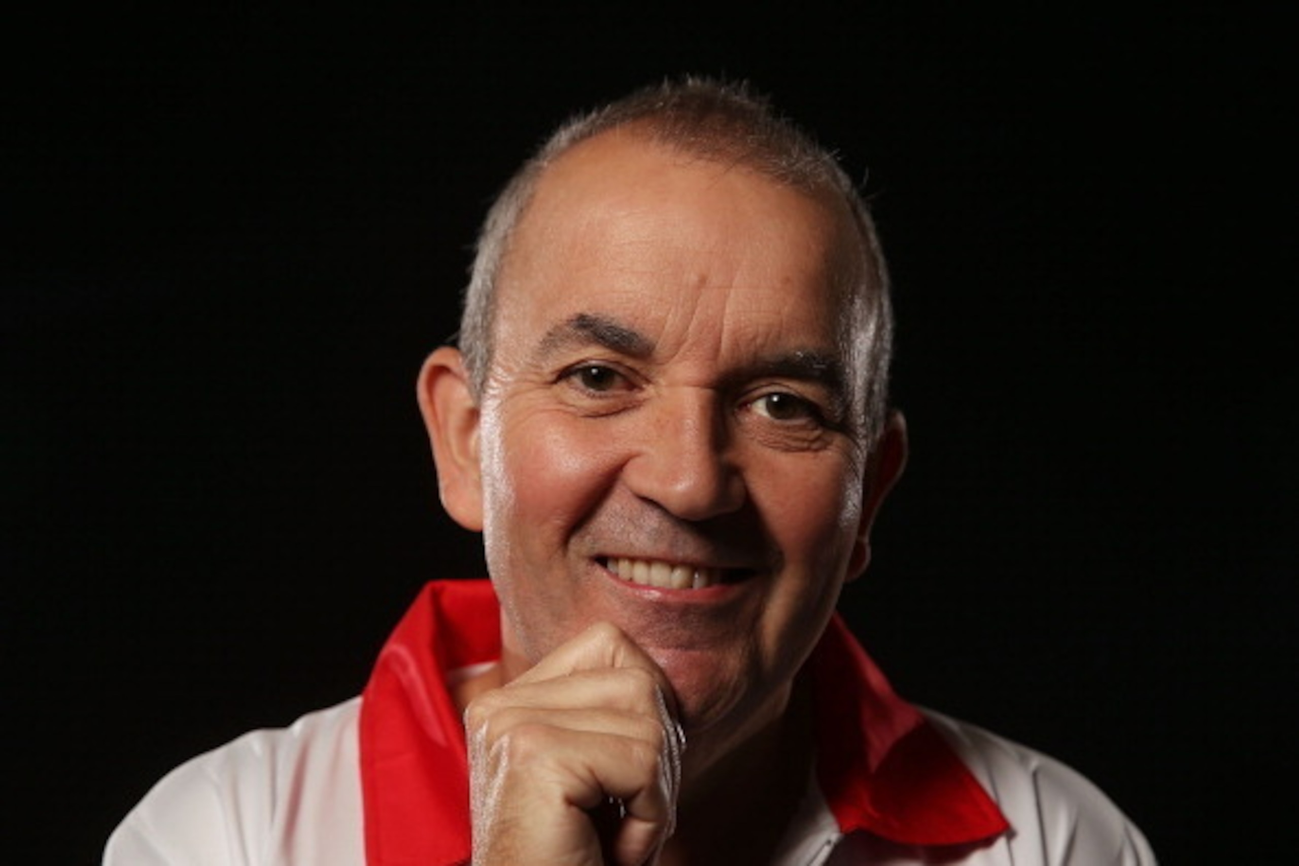 SYDNEY, AUSTRALIA - AUGUST 29:  Phil Taylor of England poses for a portrait ahead of the Sydney Darts Masters at Luna Park on August 29, 2013 in Sydney, Australia.  (Photo by Mark Metcalfe/Getty Images)