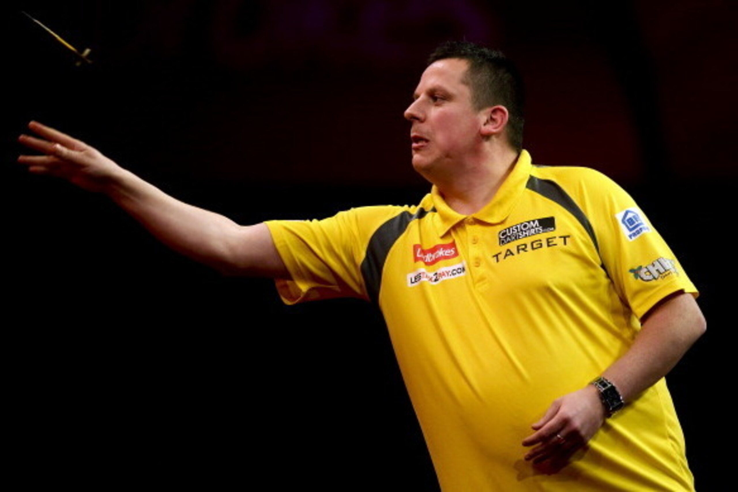 LONDON, ENGLAND - DECEMBER 27: Dave Chisnall of England in atcion during his third round match against Simon Whitlock on day eleven of the 2013 Ladbrokes.com World Darts Championship at the Alexandra Palace on December 27, 2012 in London, England. (Photo 
