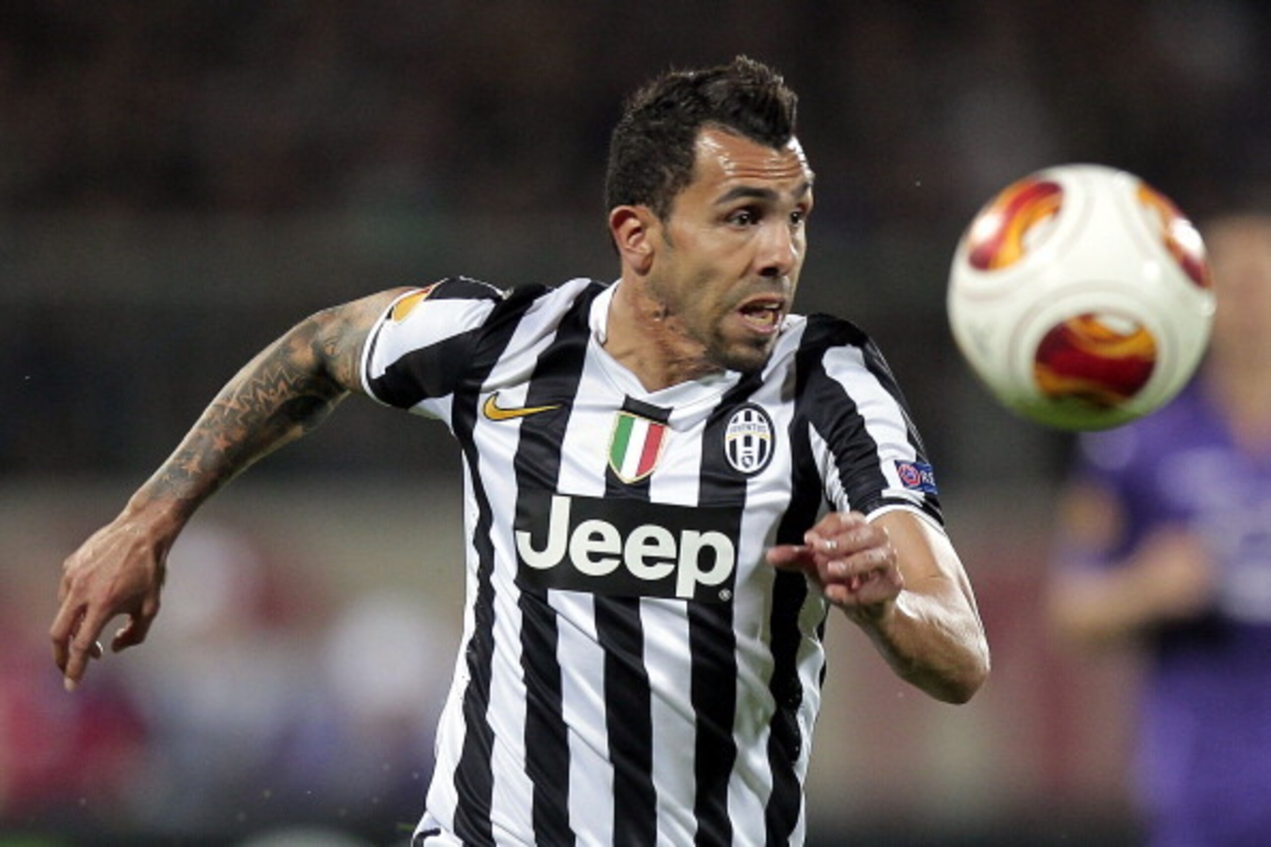 FLORENCE, ITALY - MARCH 20: Carlos Tevez of Juventus in action during the UEFA Europa League Round of 16 second leg match between ACF Fiorentina and Juventus at Stadio Artemio Franchi on March 20, 2014 in Florence, Italy.  (Photo by Gabriele Maltinti/Gett