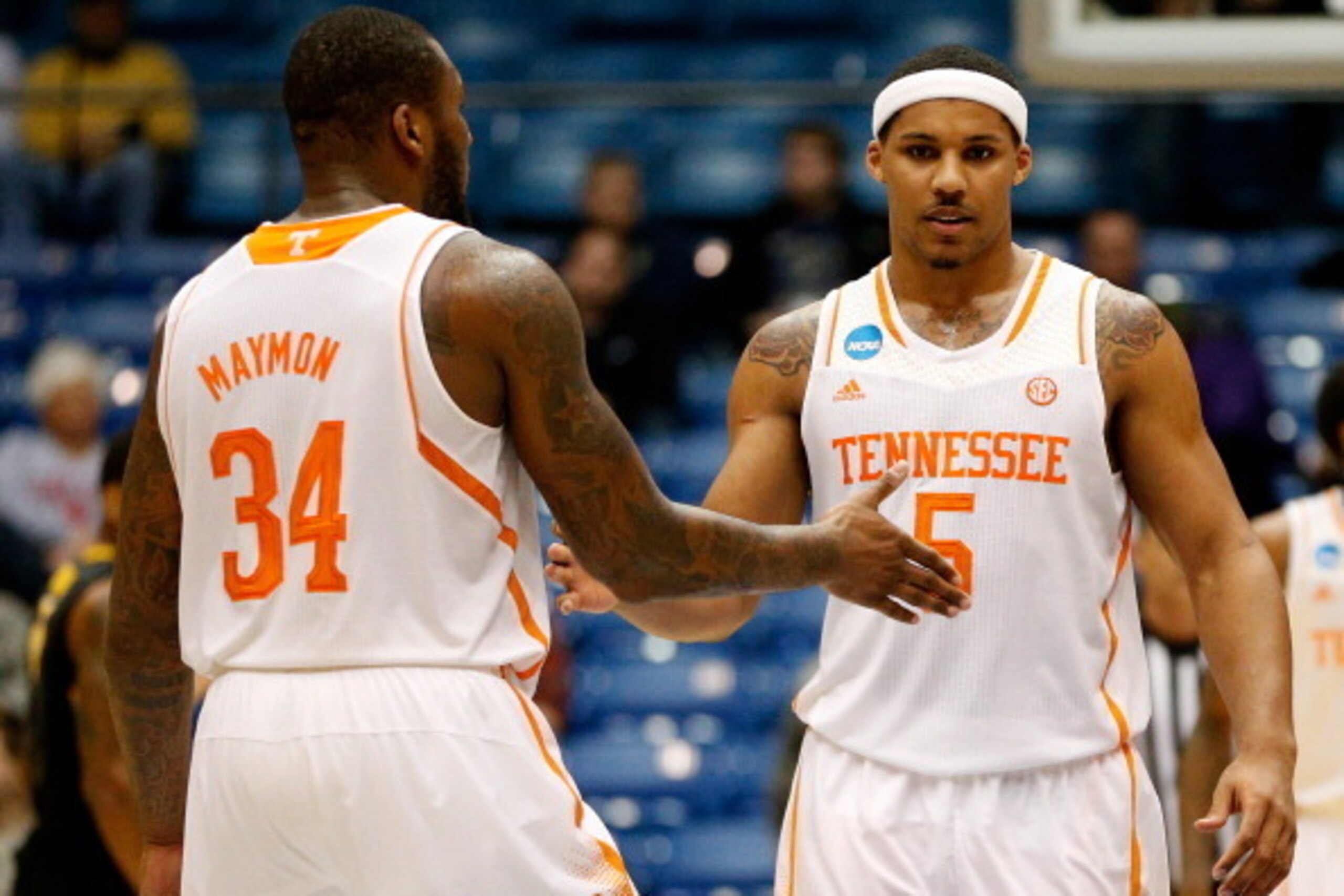 DAYTON, OH - MARCH 19: Jarnell Stokes #5 and Jeronne Maymon #34 of the Tennessee Volunteers celebrate after defeating the Iowa Hawkeyes 78-65 in overtime in the first round of the 2014 NCAA Men's Basketball Tournament at UD Arena on March 19, 2014 in Dayt