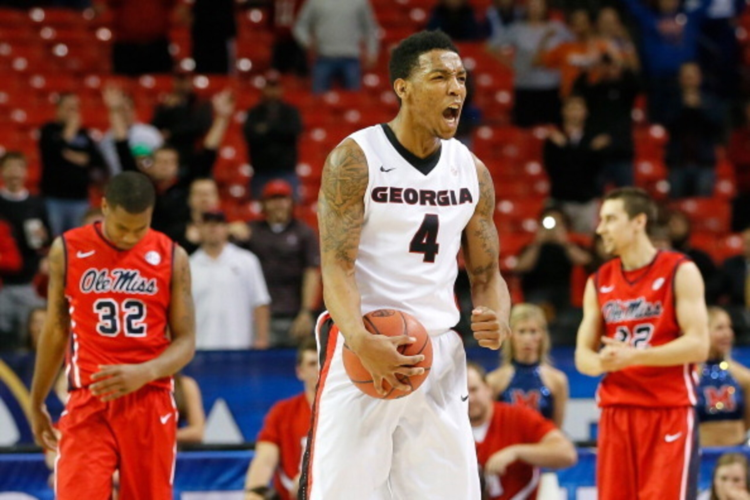 ATLANTA, GA - MARCH 14: Charles Mann #4 of the Georgia Bulldogs reacts after forcing a turnover by the Mississippi Rebels during the quarterfinals of the SEC Men's Basketball Tournament at Georgia Dome on March 14, 2014 in Atlanta, Georgia. (Photo by Ke ATLANTA, GA - MARCH 14: Charles Mann #4 of the Georgia Bulldogs reacts after forcing a turnover by the Mississippi Rebels during the quarterfinals of the SEC Men's Basketball Tournament at Georgia Dome on March 14, 2014 in Atlanta, Georgia. (Photo by Ke