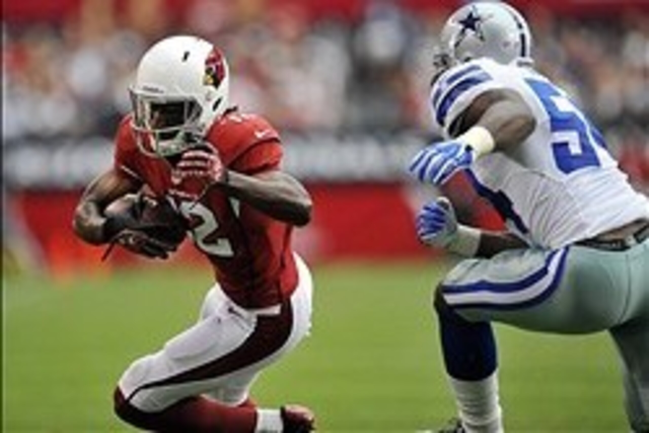 August 17, 2013; Phoenix, AZ, USA; Arizona Cardinals wide receiver Andre Roberts (12) runs the ball against the defense of Dallas Cowboys inside linebacker Bruce Carter (54) during the first half at University of Phoenix Stadium. Mandatory Credit: Gary A. August 17, 2013; Phoenix, AZ, USA; Arizona Cardinals wide receiver Andre Roberts (12) runs the ball against the defense of Dallas Cowboys inside linebacker Bruce Carter (54) during the first half at University of Phoenix Stadium. Mandatory Credit: Gary A.