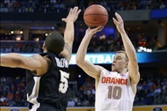 Mar 20, 2014; Buffalo, NY, USA; Syracuse Orange guard Trevor Cooney (10) shoots over Western Michigan Broncos guard David Brown (5) in the first half of a men's college basketball game during the second round of the 2014 NCAA Tournament at First Niagara C