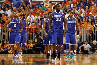 Mar 8, 2014; Gainesville, FL, USA; Kentucky Wildcats forward Julius Randle (30), guard/forward James Young (1),  forward Willie Cauley-Stein (15),  guard Aaron Harrison (2) and guard Andrew Harrison (5) look at the bench against the Tampa Bay Rays during