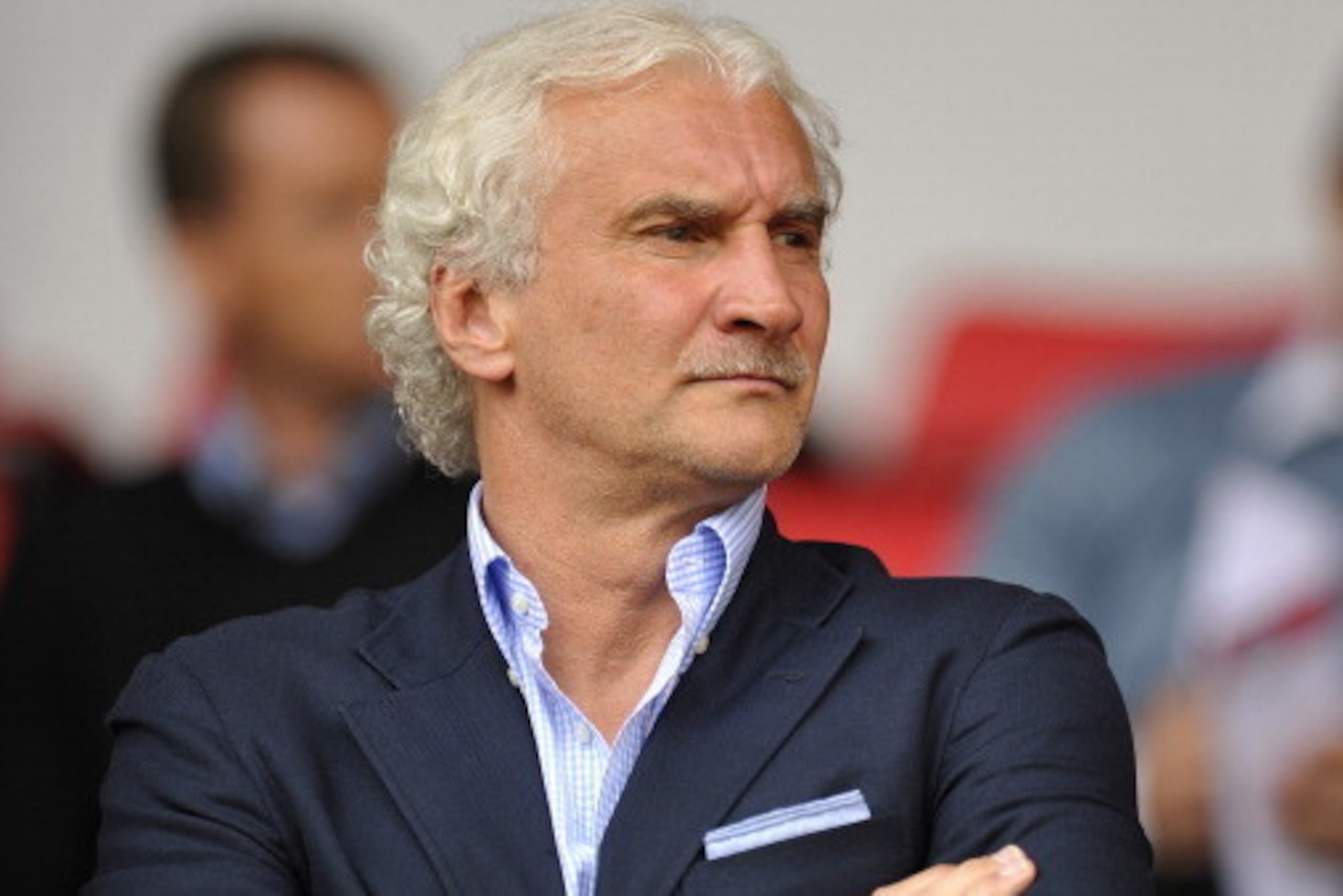 LIVERPOOL, ENGLAND - AUGUST 12:  Rudi Voller Director of Sport of Bayer Leverkusen in the stands during the pre season friendly match between Liverpool and Bayer Leverkusen at Anfield on August 12, 2012 in Liverpool, England. (Photo by Clint Hughes/Getty 