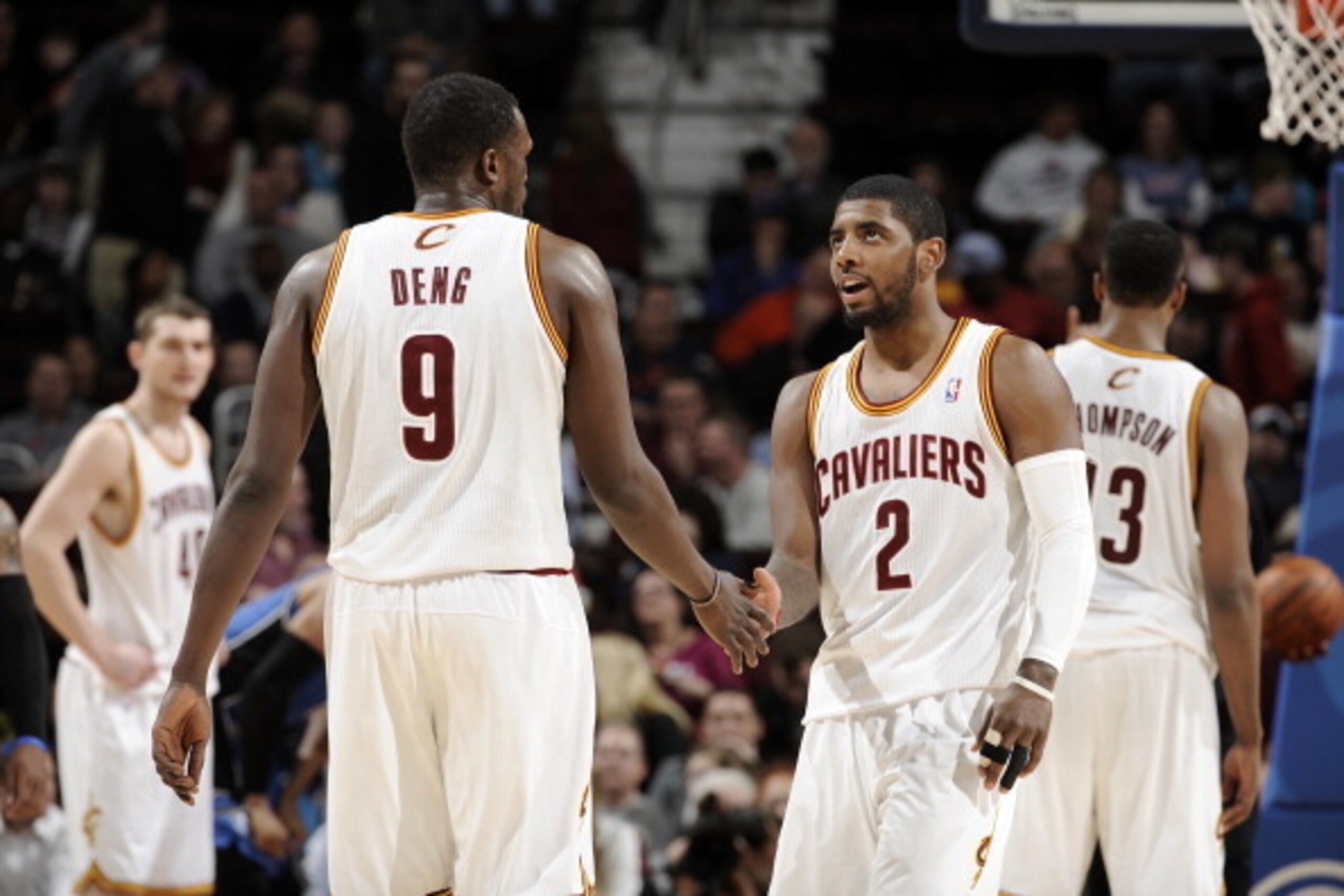 CLEVELAND, OH - FEBRUARY 19:  Luol Deng #9 and Kyrie Irving #2 of the Cleveland Cavaliers shake hands following their victory over the Orlando Magic at The Quicken Loans Arena on February 19, 2014 in Cleveland, Ohio. NOTE TO USER: User expressly acknowled