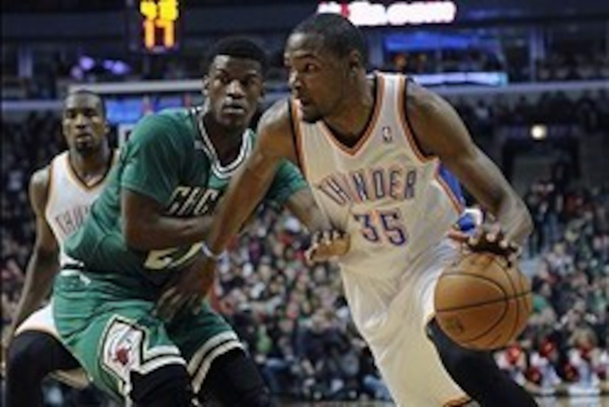 Mar 17, 2014; Chicago, IL, USA; Oklahoma City Thunder forward Kevin Durant (35) drives past Chicago Bulls guard Jimmy Butler (21) during the first quarter at the United Center. Mandatory Credit: David Banks-USA TODAY Sports