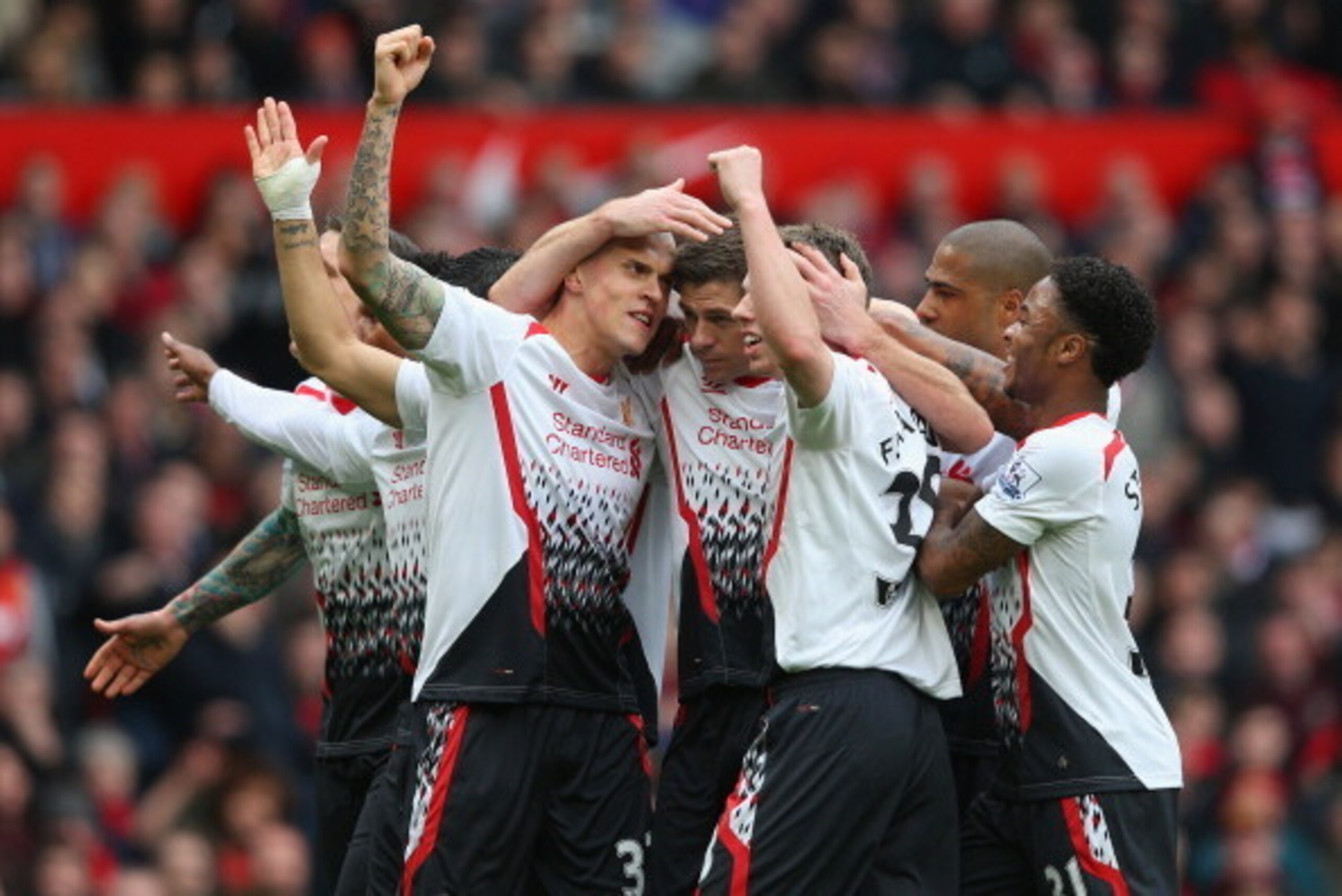 MANCHESTER, ENGLAND - MARCH 16: Steven Gerrard of Liverpool celebrates scoring the first goal with his team-mates during the Barclays Premier League match between Manchester United and Liverpool at Old Trafford on March 16, 2014 in Manchester, England. MANCHESTER, ENGLAND - MARCH 16: Steven Gerrard of Liverpool celebrates scoring the first goal with his team-mates during the Barclays Premier League match between Manchester United and Liverpool at Old Trafford on March 16, 2014 in Manchester, England.