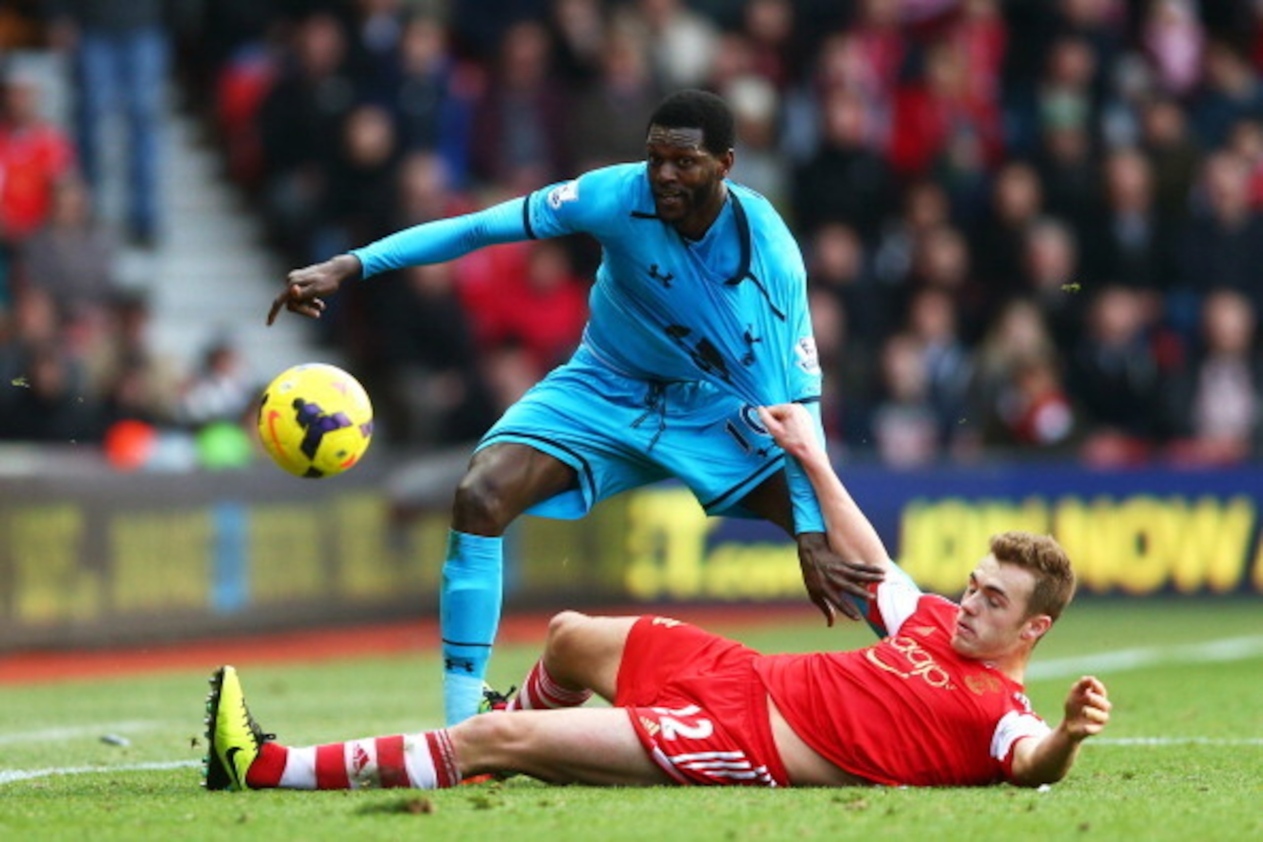 SOUTHAMPTON, ENGLAND - DECEMBER 22: Emmanuel Adebayor of Spurs is tackled by Morgan Schneiderlin of Southampton during the Barclays Premier League match between Southampton and Tottenham Hotspur at St Mary's Stadium on December 22, 2013 in Southampton, En