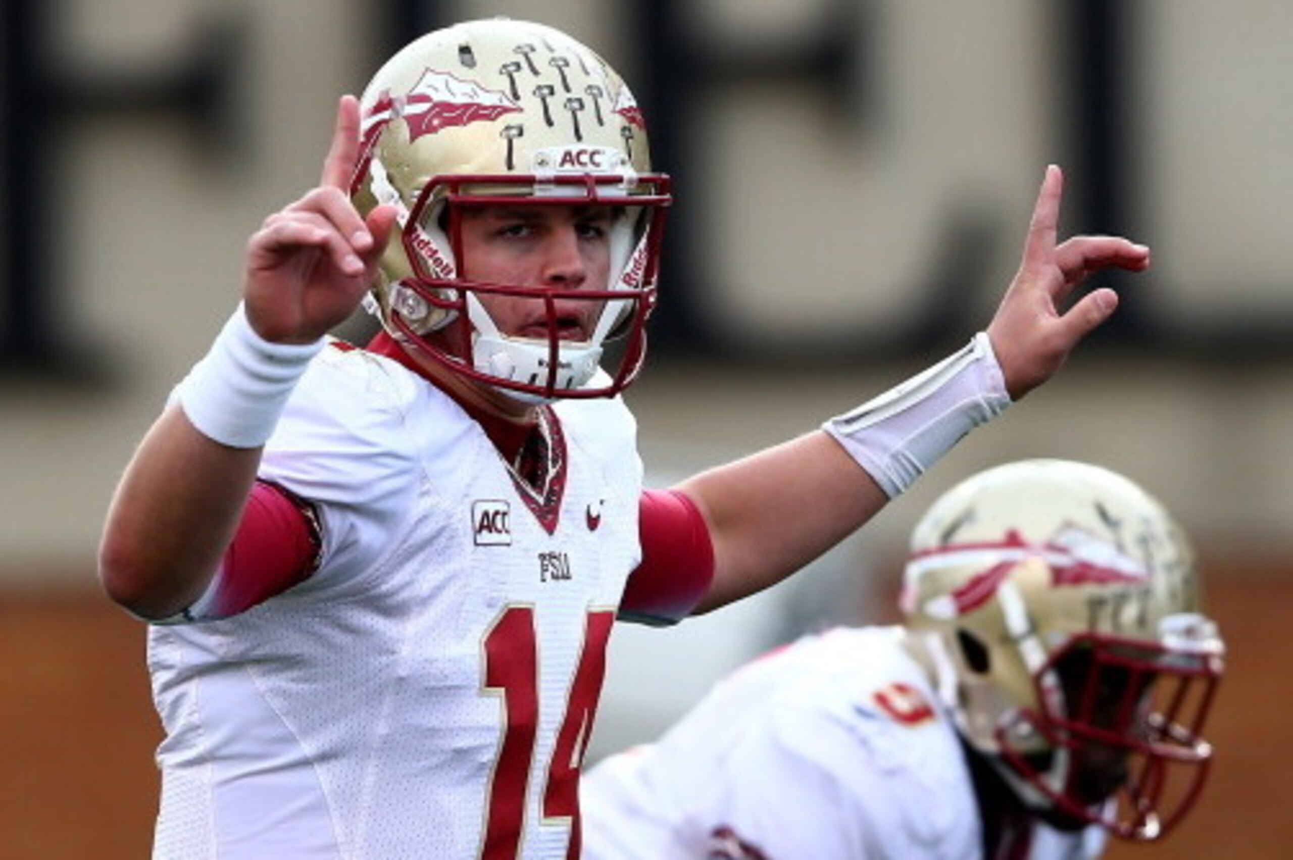 WINSTON SALEM, NC - NOVEMBER 09:  Jacob Coker #14 of the Florida State Seminoles calls a play against the Wake Forest Demon Deacons during their game at BB&T Field on November 9, 2013 in Winston Salem, North Carolina.  (Photo by Streeter Lecka/Getty Image