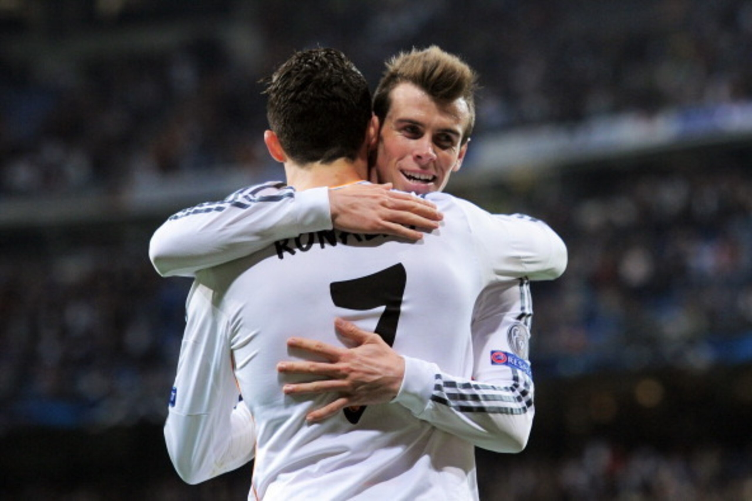 MADRID, SPAIN - MARCH 18:  Cristiano Ronaldo of Real Madrid celebrates with teammate Gareth Bale after scoring his team's second goal during the UEFA Champions League Round of 16, second leg match between Real Madrid and FC Schalke 04 at Estadio Santiago 