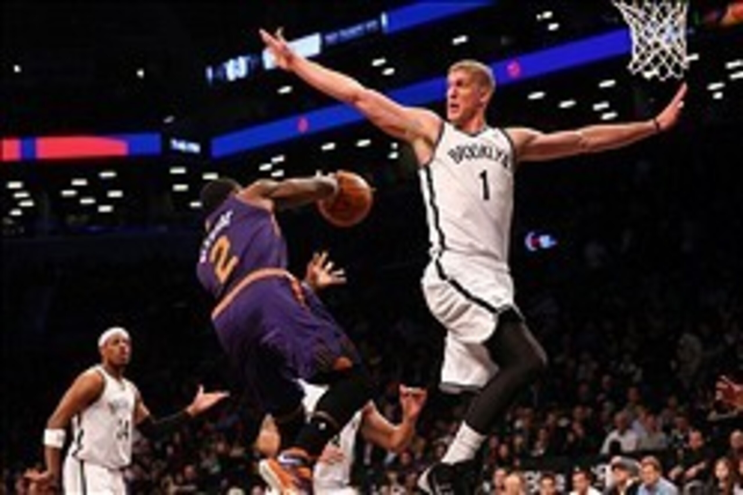 Mar 17, 2014; Brooklyn, NY, USA; Phoenix Suns guard Eric Bledsoe (2) passes behind Brooklyn Nets forward Mason Plumlee (1) during the first quarter at Barclays Center. Mandatory Credit: Anthony Gruppuso-USA TODAY Sports Mar 17, 2014; Brooklyn, NY, USA; Phoenix Suns guard Eric Bledsoe (2) passes behind Brooklyn Nets forward Mason Plumlee (1) during the first quarter at Barclays Center. Mandatory Credit: Anthony Gruppuso-USA TODAY Sports