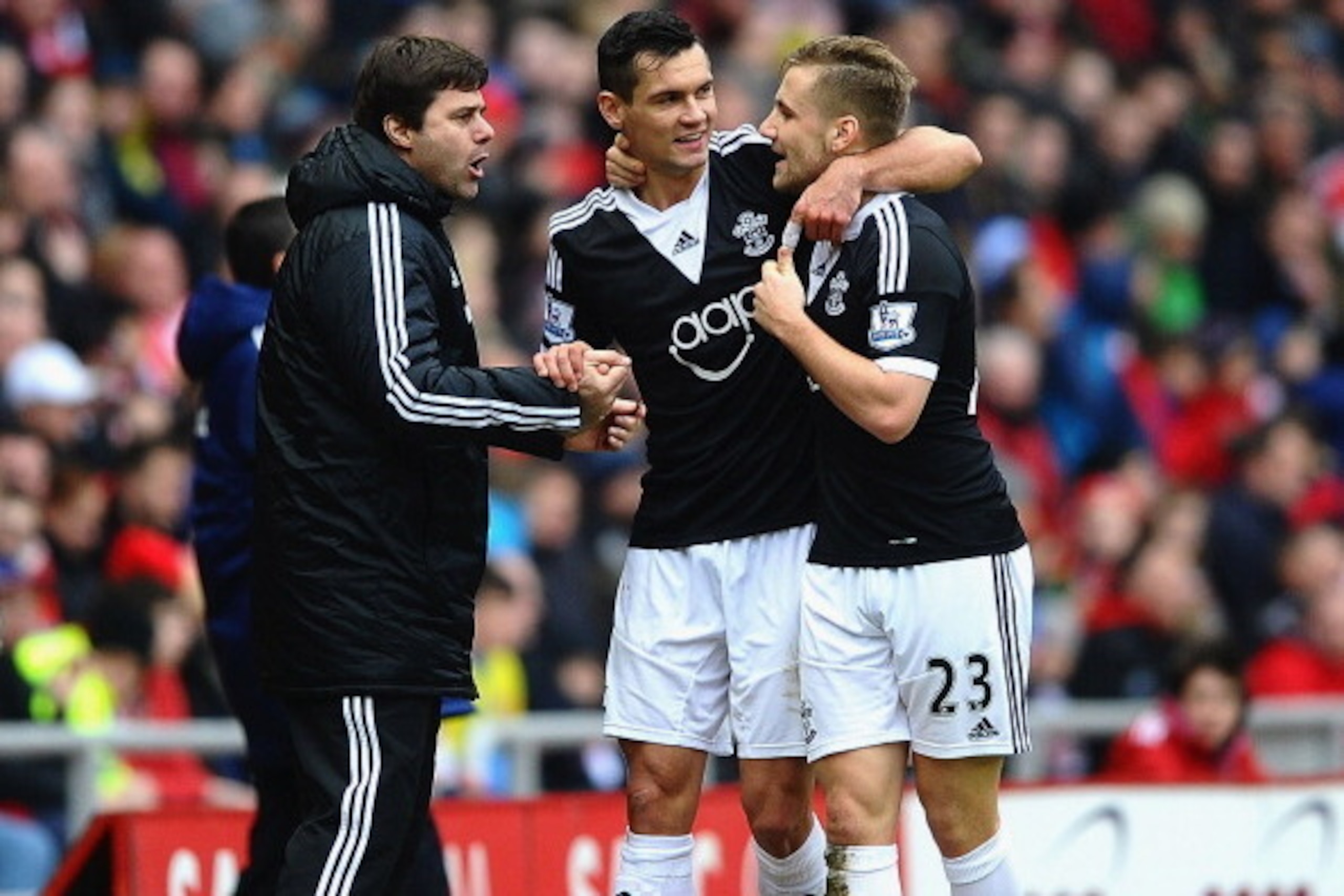 SUNDERLAND, ENGLAND - JANUARY 18:  Dejan Lovren of Southampton (C) celebrates with Mauricio Pochettino manager of Southampton (L) and Luke Shaw (23) as he scores their second goal during the Barclays Premier League match between Sunderland and Southampton