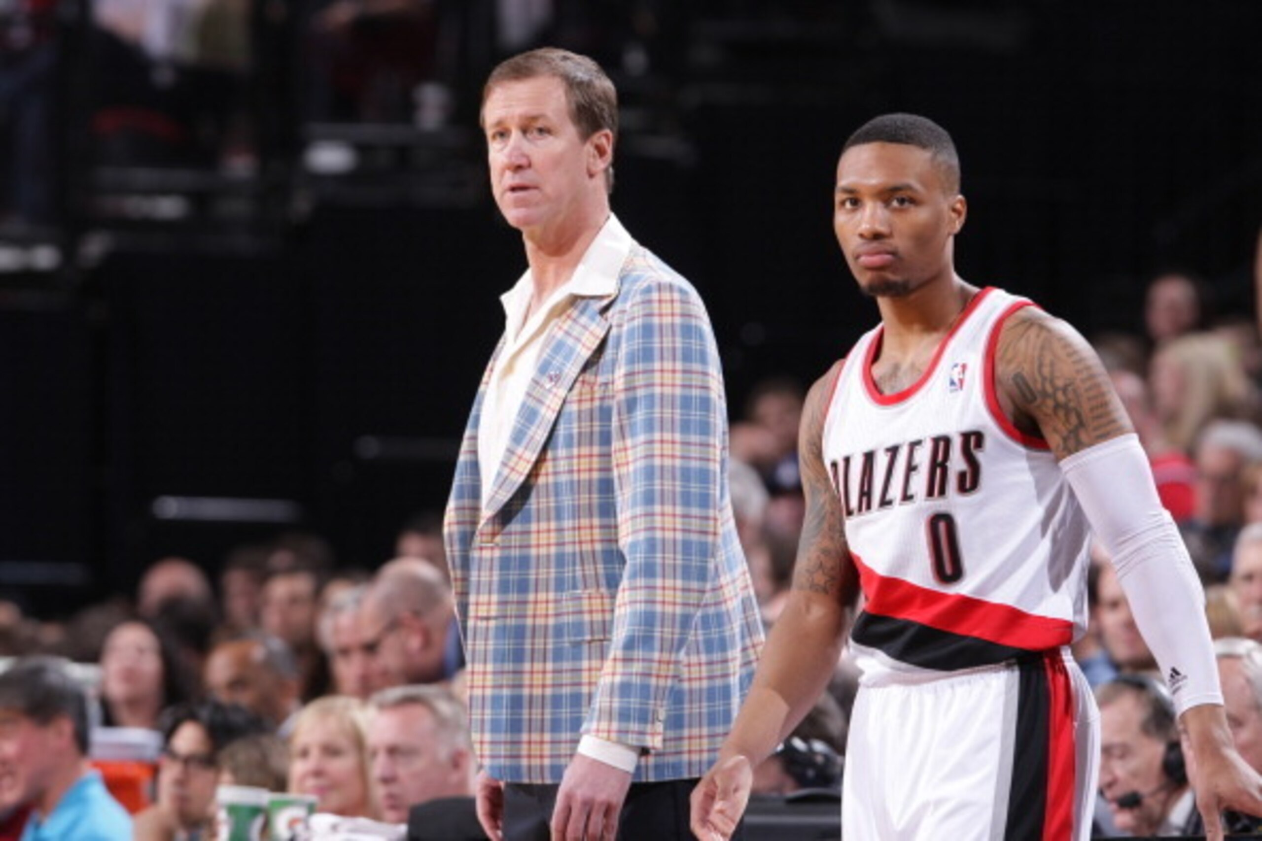 PORTLAND, OR - FEBRUARY 21: Head coach Terry Stotts and Damian Lillard #0 of the Portland Trail Blazers look on against the Utah Jazz on February 21, 2014 at the Moda Center Arena in Portland, Oregon. NOTE TO USER: User expressly acknowledges and agrees t