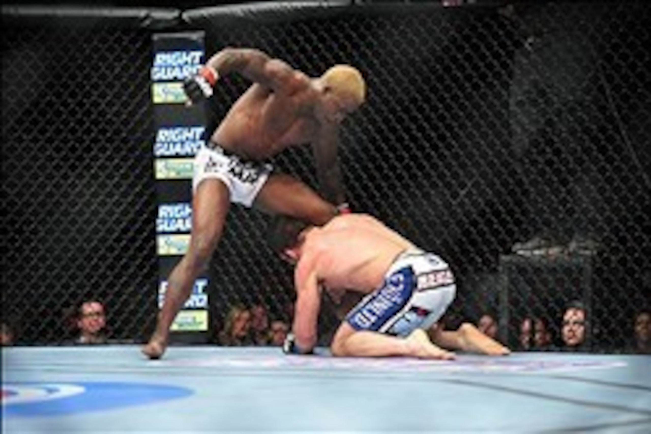 Dec 29, 2012; Las Vegas, NV, USA; Melvin Guillard (top) strikes Jamie Varner (bottom) during UFC 155 at the MGM Grand Garden Arena. Mandatory Credit: Gary A. Vasquez-USA TODAY Sports