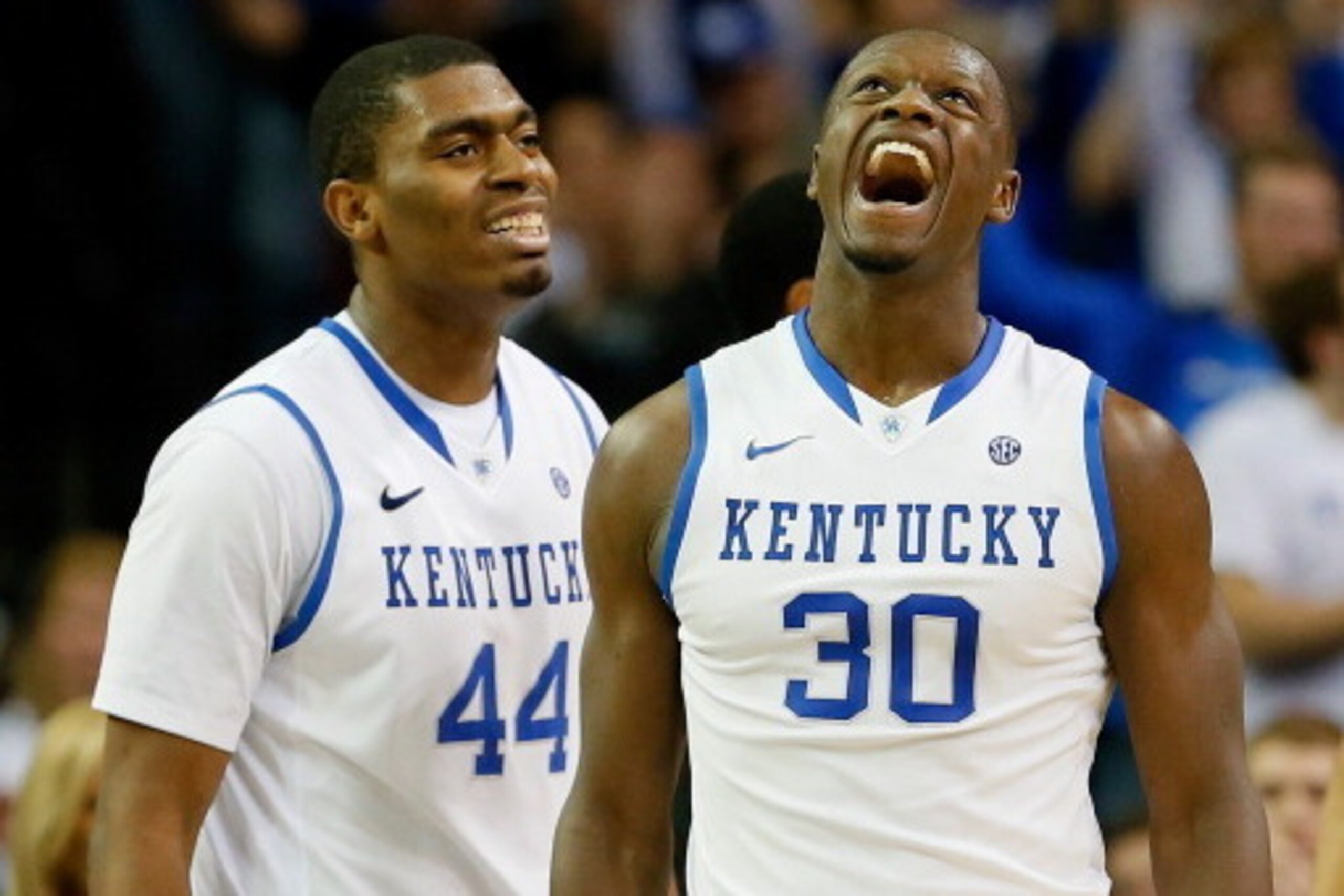 ATLANTA, GA - MARCH 14:  Dakari Johnson #44 and Julius Randle #30 of the Kentucky Wildcats react after Randle drew a foul against LSU Tigers during the quarterfinals of the SEC Men's Basketball Tournament at Georgia Dome on March 14, 2014 in Atlanta, Geor
