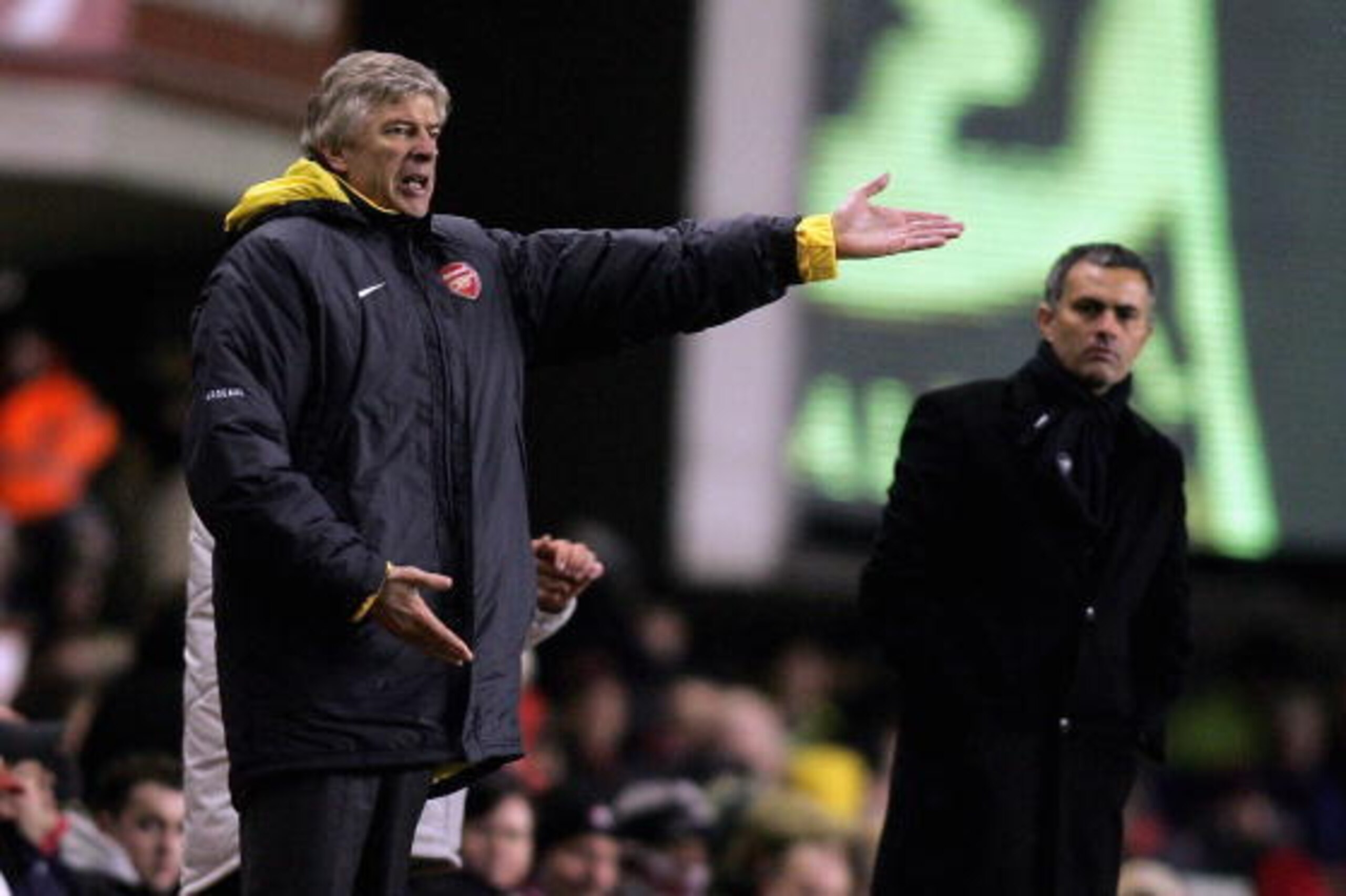 LONDON - DECEMBER 18:  Arsenal Manager Arsene Wenger (L) and Chelsea Manager Jose Mourinho (R) give instructions from the sidelines during the Barclays Premiership match between Arsenal and Chelsea at Highbury on December 18, 2005 in London, England.  (Ph
