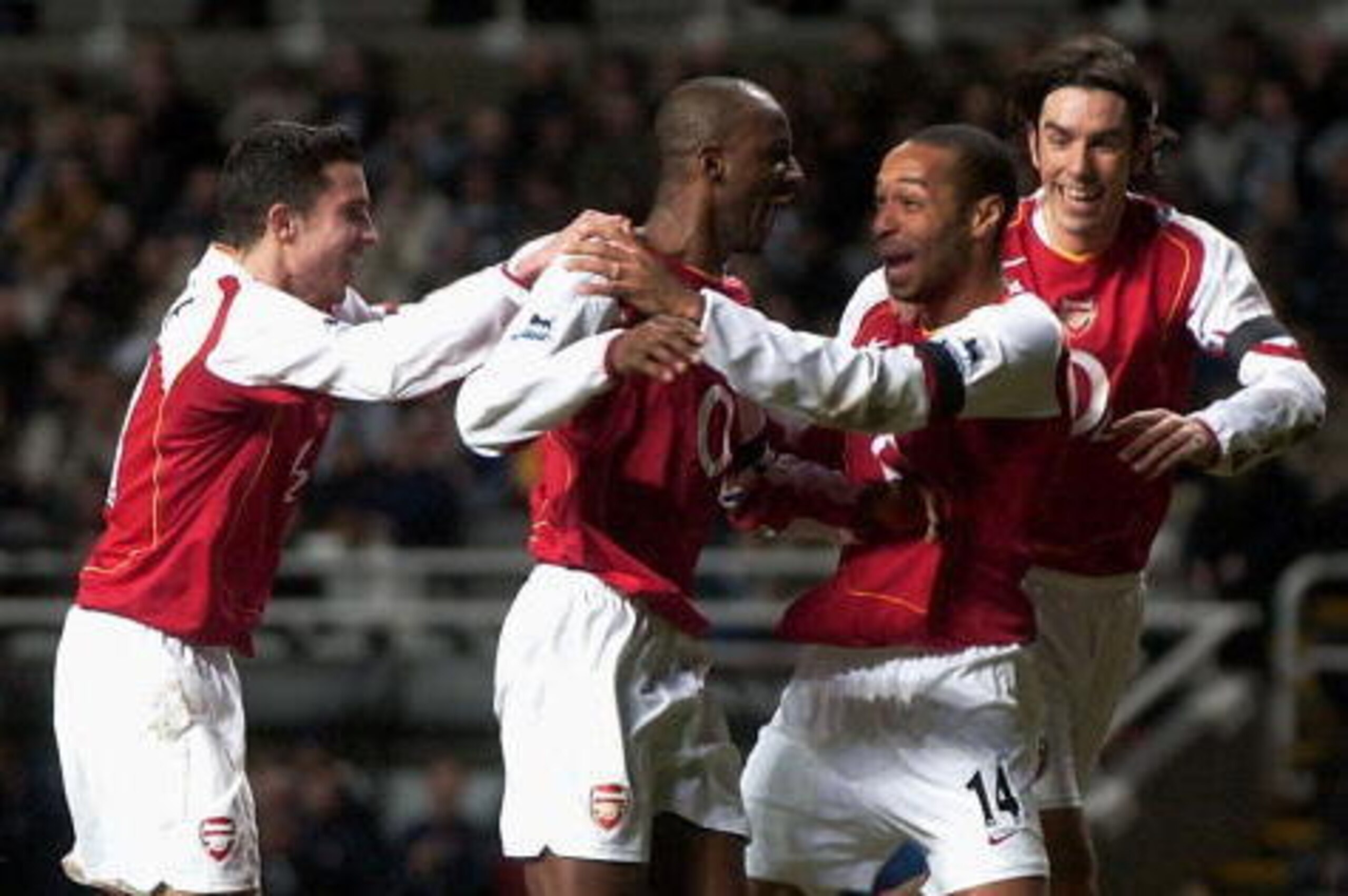 NEWCASTLE, ENGLAND - DECEMBER 29: Thierry Henry of Arsenal congratulates Patrick Vieira on his goal during the FA Barclays Premiership match between Newcastle United and Arsenal at St.James Park on December 29, 2004 in Newcastle, England. (Photo by Matthe