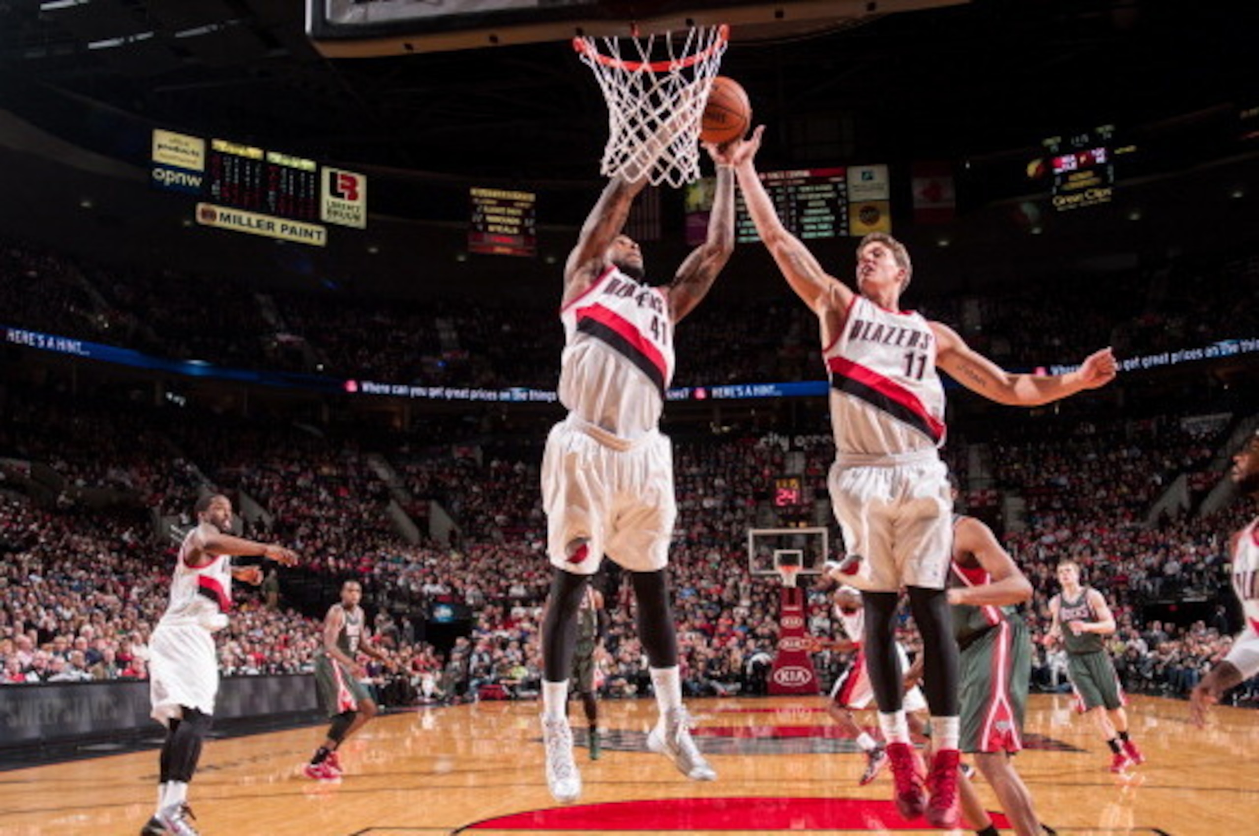 PORTLAND, OR - MARCH 18:  Thomas Robinson #41 and Meyers Leonard #11 of the Portland Trail Blazers goes up for a rebound against the Milwaukee Bucks on March 18, 2014 at the Moda Center Arena in Portland, Oregon. NOTE TO USER: User expressly acknowledges 