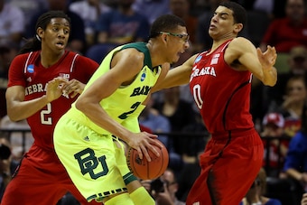 SAN ANTONIO, TX - MARCH 21: Isaiah Austin #21 of the Baylor Bears handles the ball against David Rivers #2 and Tai Webster #0 of the Nebraska Cornhuskers in the first half during the second round of the 2014 NCAA Men's Basketball Tournament at AT&T Center SAN ANTONIO, TX - MARCH 21: Isaiah Austin #21 of the Baylor Bears handles the ball against David Rivers #2 and Tai Webster #0 of the Nebraska Cornhuskers in the first half during the second round of the 2014 NCAA Men's Basketball Tournament at AT&T Center