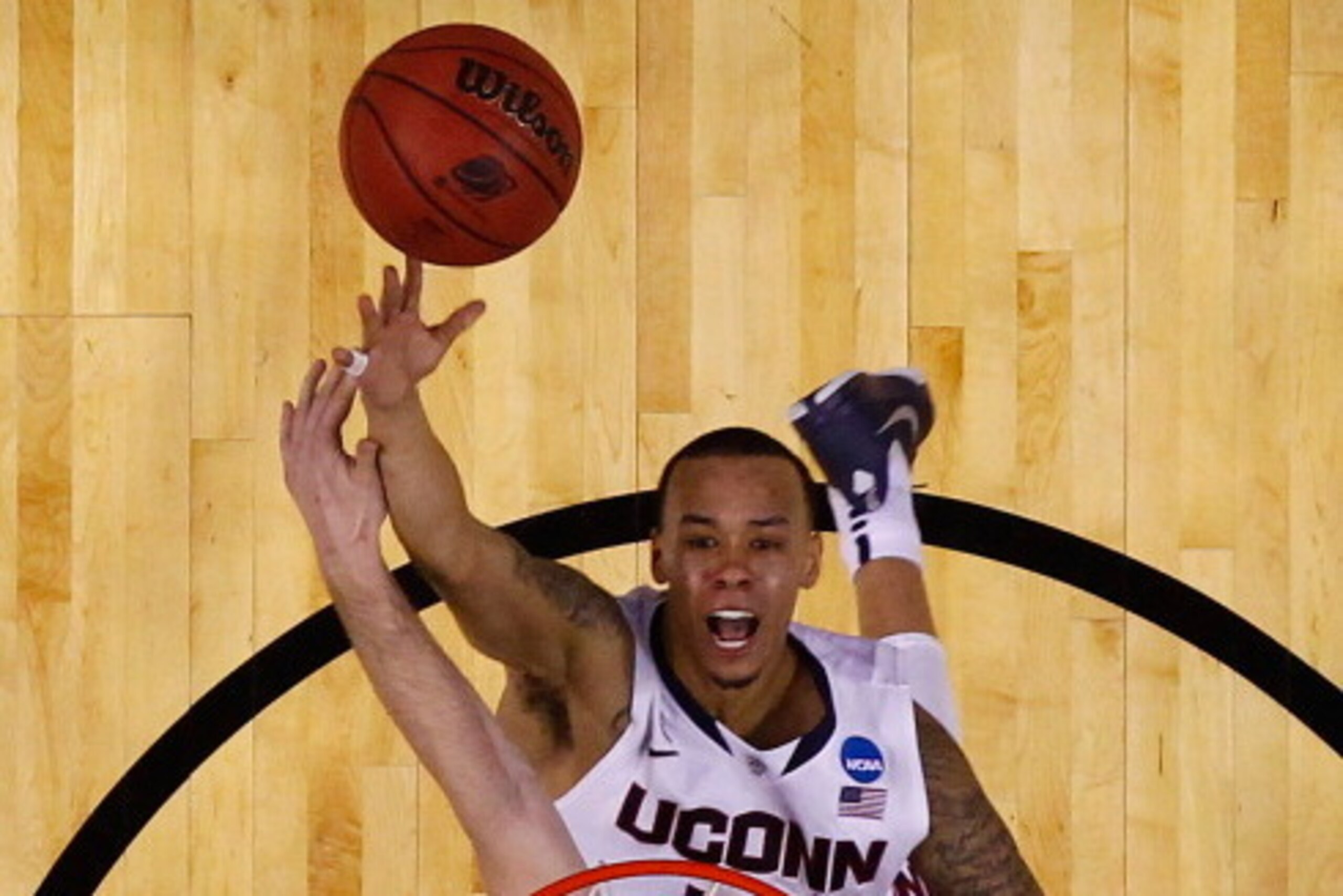 BUFFALO, NY - MARCH 20: Shabazz Napier #13 of the Connecticut Huskies goes up for a layup against the Saint Joseph's Hawks during the second round of the 2014 NCAA Men's Basketball Tournament at the First Niagara Center on March 20, 2014 in Buffalo, New Y