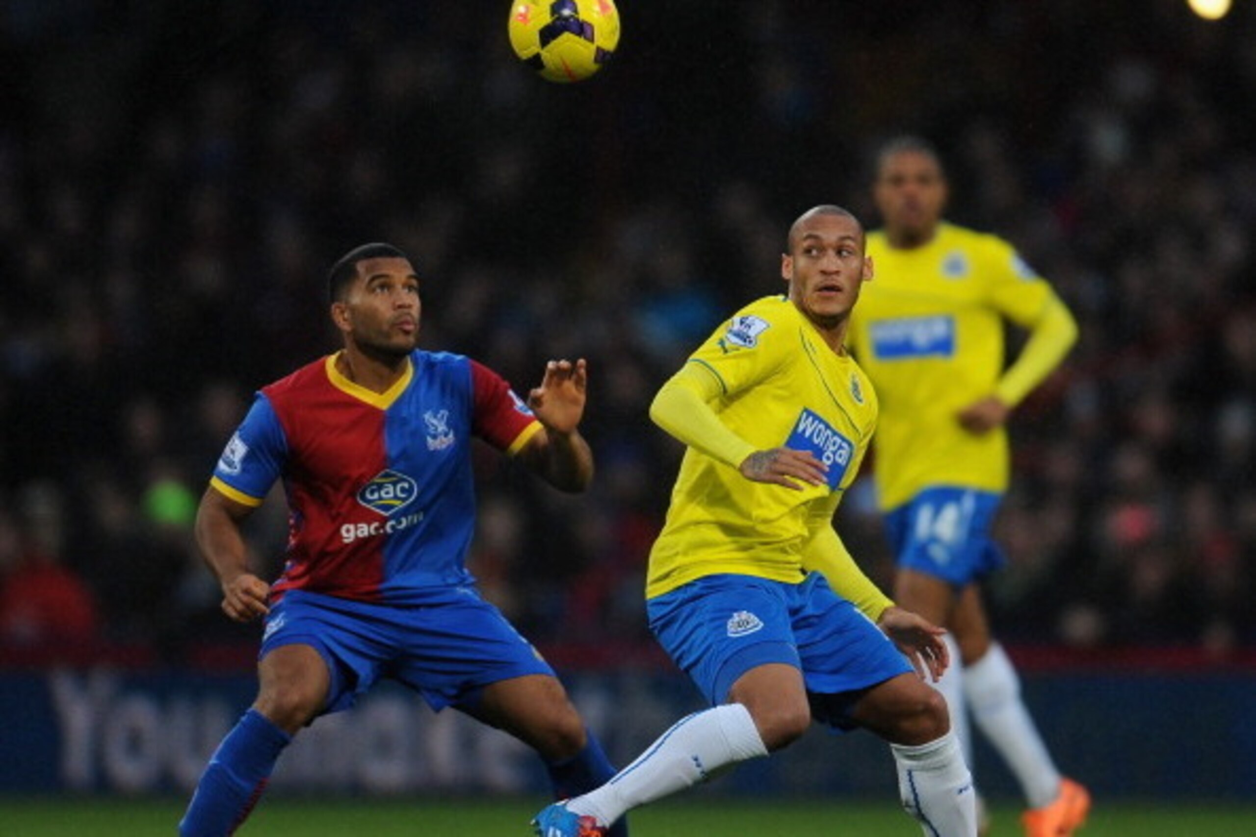 LONDON, ENGLAND - DECEMBER 21: Adrian Mariappa of Crystal Palace and Yoan Gouffran (R) of Newcastle United compete for the ball during the Barclays Premier League match between Crystal Palace and Newcastle United at Selhurst Park on December 21, 2013 in L