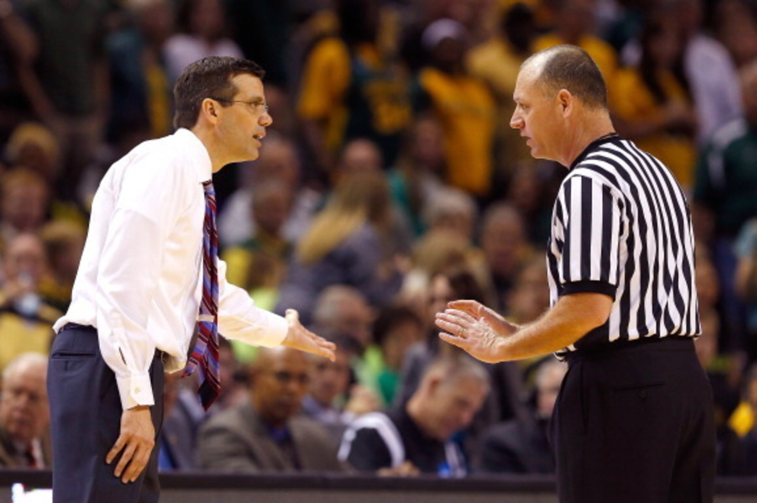 SAN ANTONIO, TX - MARCH 21:  Head coach Tim Miles of the Nebraska Cornhuskers talks to an official after receiving his second technical foul in the second half against the Baylor Bears during the second round of the 2014 NCAA Men's Basketball Tournament a
