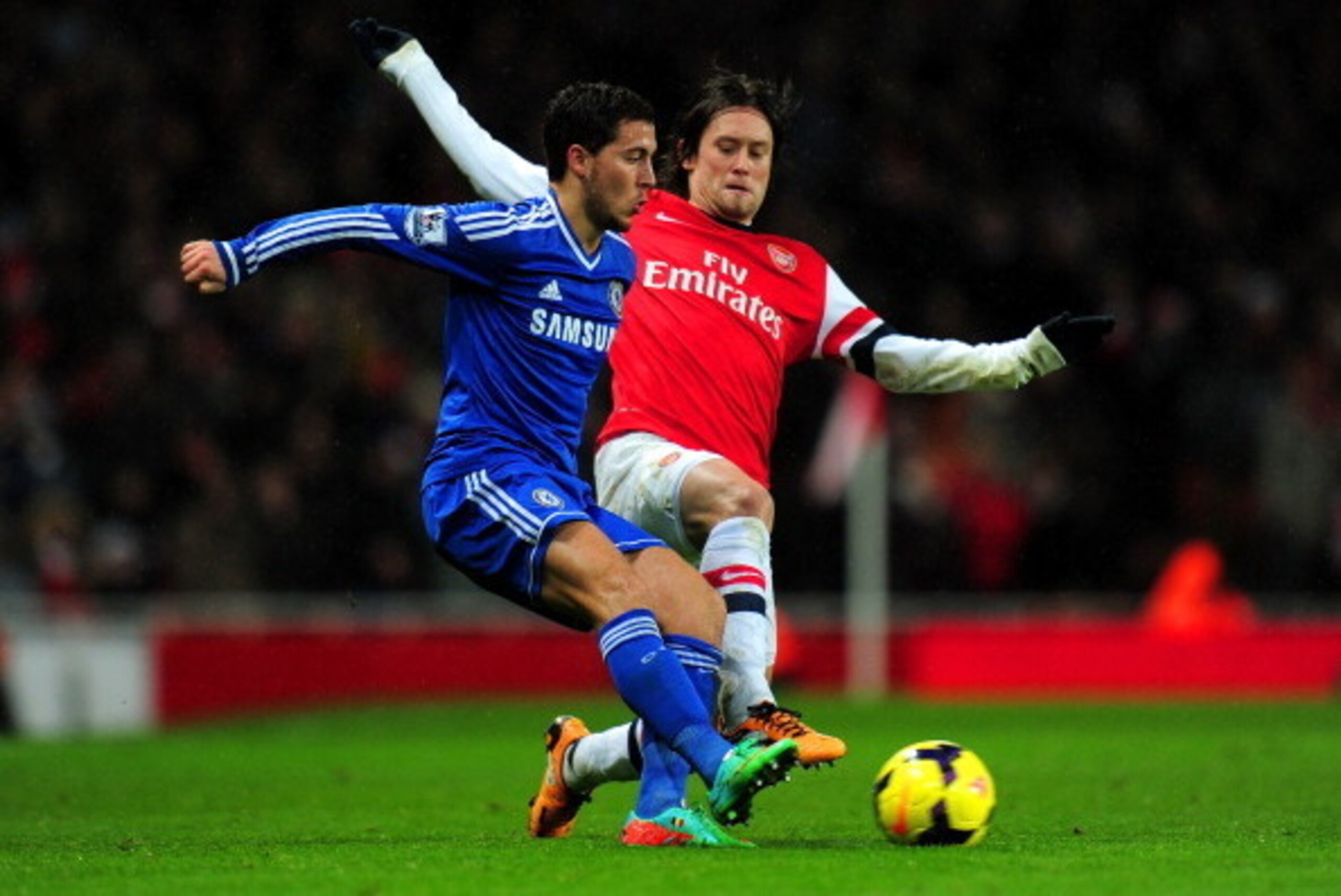 LONDON, ENGLAND - DECEMBER 23:  Tomas Rosicky of Arsenal tackles Eden Hazard of Chelsea during the Barclays Premier League match between Arsenal and Chelsea at Emirates Stadium on December 23, 2013 in London, England.  (Photo by Shaun Botterill/Getty Imag