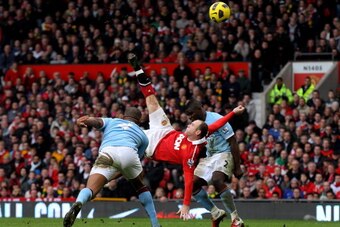 MANCHESTER, ENGLAND - FEBRUARY 12:  Wayne Rooney of Manchester United scores a goal from an overhead kick during the Barclays Premier League match between Manchester United and Manchester City at Old Trafford on February 12, 2011 in Manchester, England.  