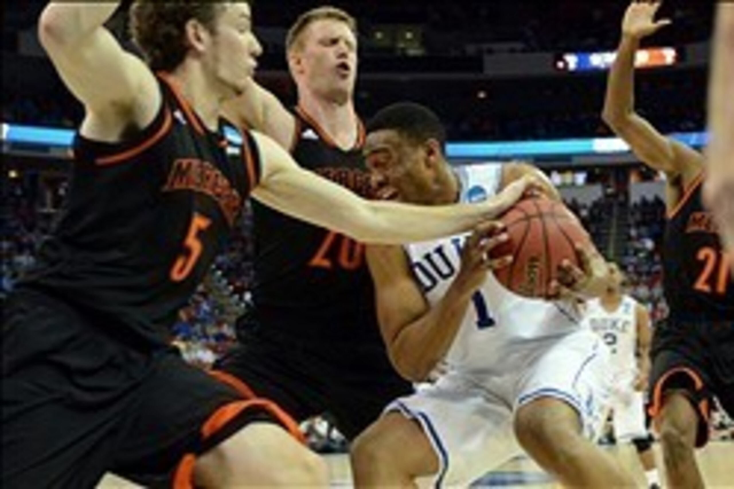 Mar 21, 2014; Raleigh, NC, USA; Duke Blue Devils forward Jabari Parker (1) drives to the basket against Mercer Bears forward Bud Thomas (5) and forward Jakob Gollon (20) in the first half of a men's college basketball game during the second round of the 2