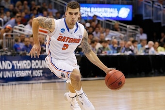 ORLANDO, FL - MARCH 20:  Scottie Wilbekin #5 of the Florida Gators drives in the first half against the Albany Great Danes during the second round of the 2014 NCAA Men's Basketball Tournament at Amway Center on March 20, 2014 in Orlando, Florida.  (Photo 