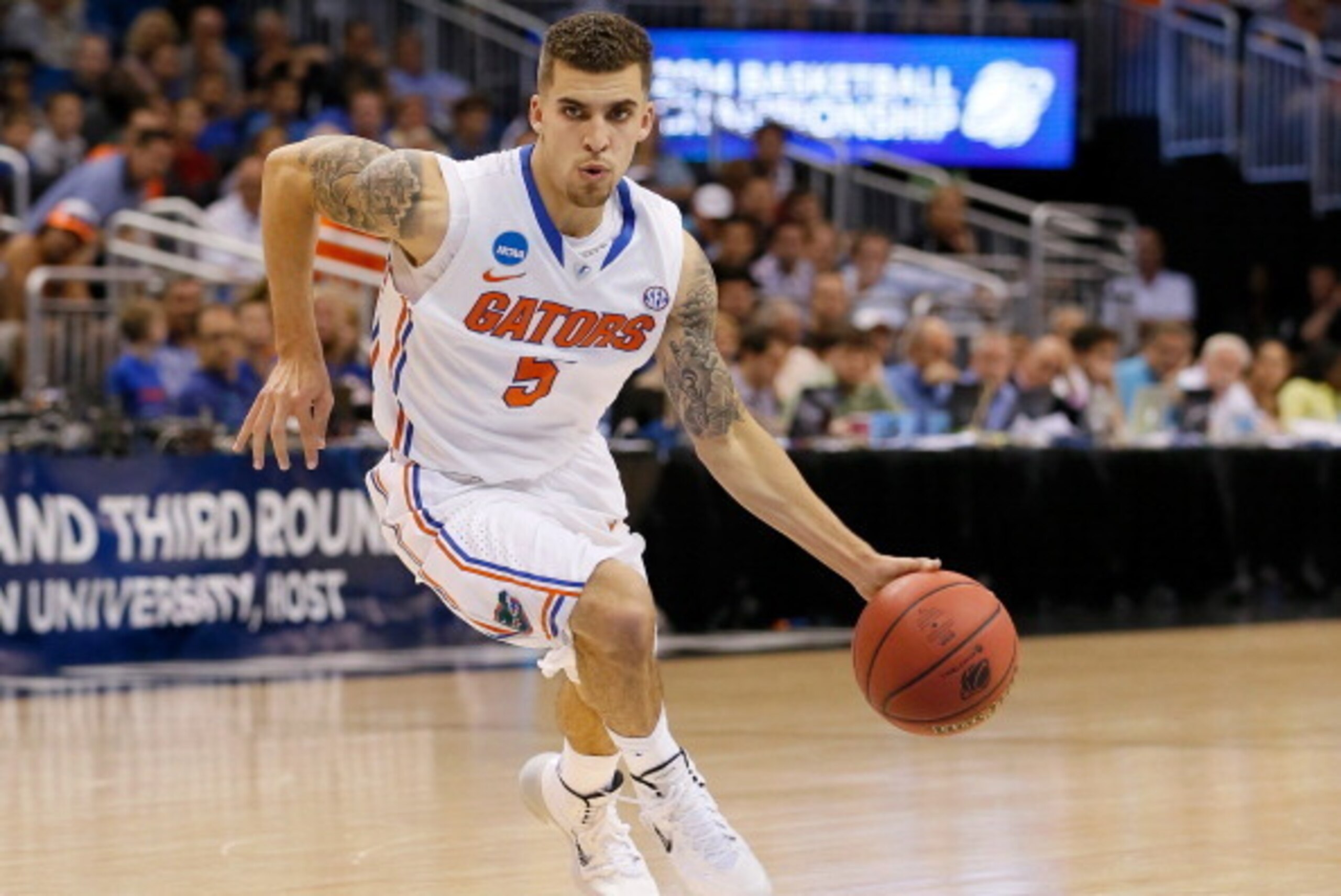 ORLANDO, FL - MARCH 20:  Scottie Wilbekin #5 of the Florida Gators drives in the first half against the Albany Great Danes during the second round of the 2014 NCAA Men's Basketball Tournament at Amway Center on March 20, 2014 in Orlando, Florida.  (Photo 