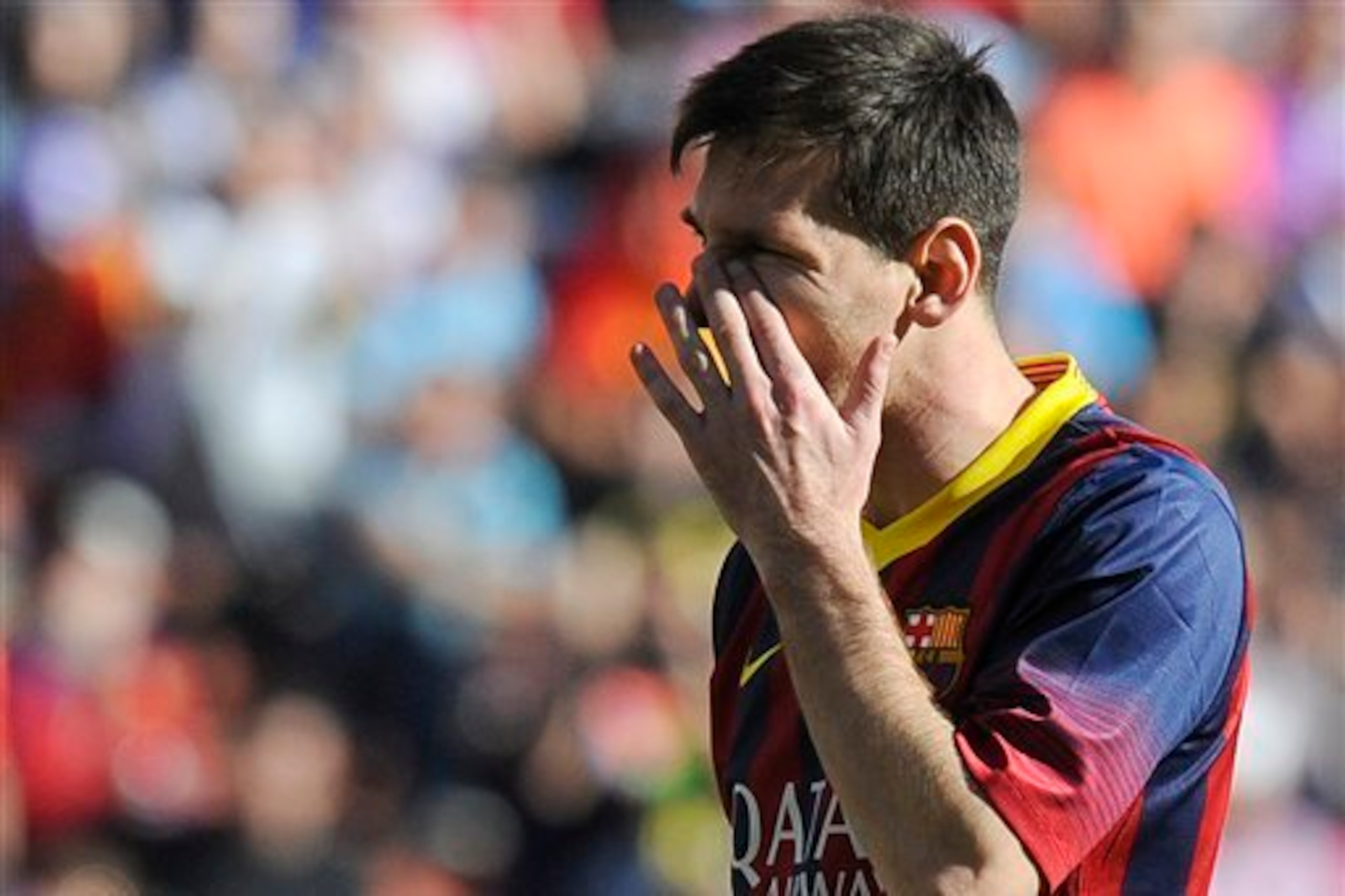 FC Barcelona's Lionel Messi gestures during a Spanish La Liga soccer match against Real Valladolid at the Jose Zorrilla stadium in Valladolid, Spain on Saturday March 8, 2014. (AP Photo/Israel L. Murillo)