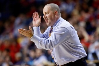 LEXINGTON, KY - MARCH 23: Head coach Buzz Williams of the Marquette Golden Eagles reacts on the sideline after a play in the second half against the Butler Bulldogs during the third round of the 2013 NCAA Men's Basketball Tournament at Rupp Arena on March