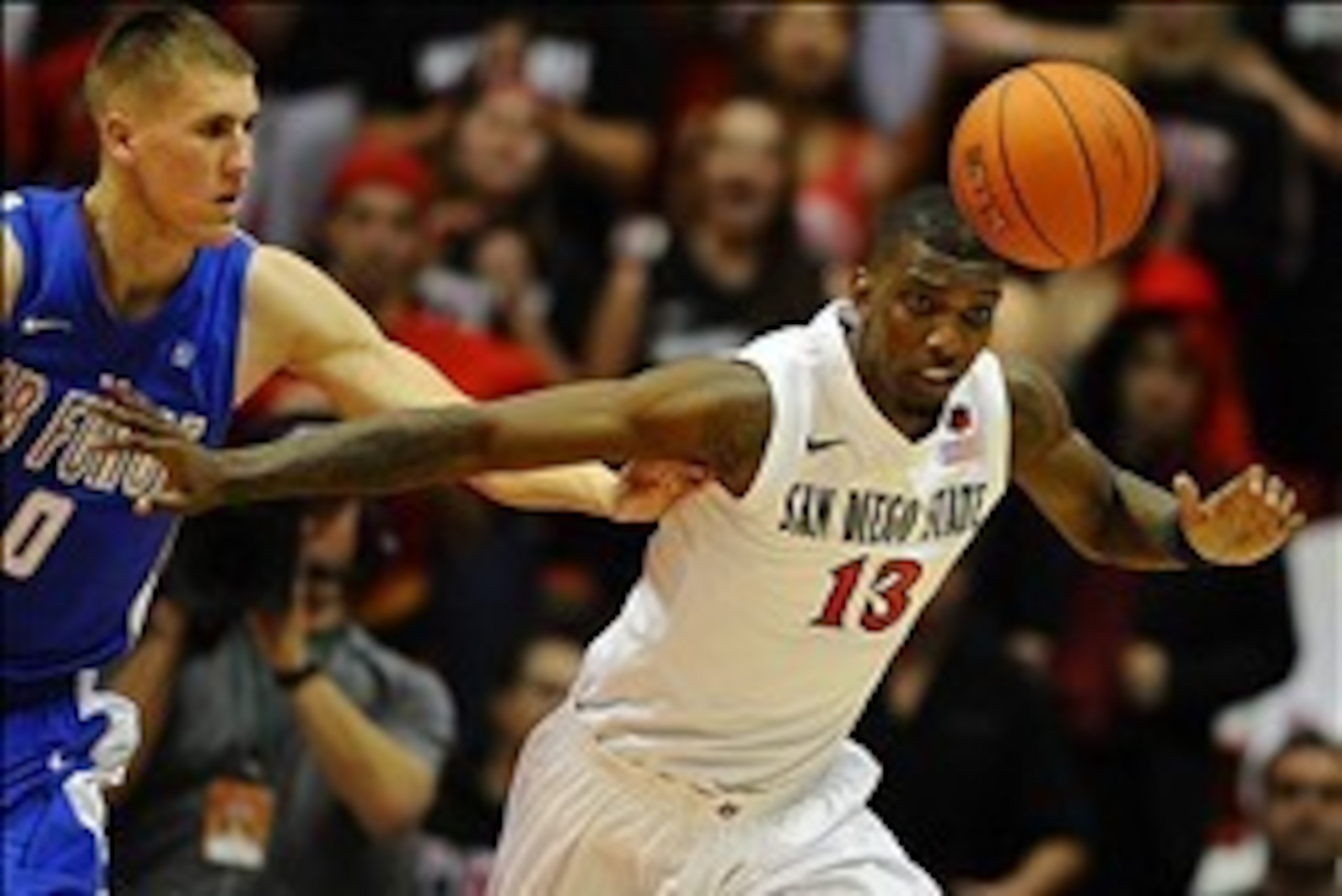 Feb 15, 2014; San Diego, CA, USA; San Diego State Aztecs forward Winston Shepard (13) battles for a loose ball with Air Force Falcons forward Marek Olesinski (0) during the second half Viejas Arena. The Aztecs won 64-56. Mandatory Credit: Christopher Hane