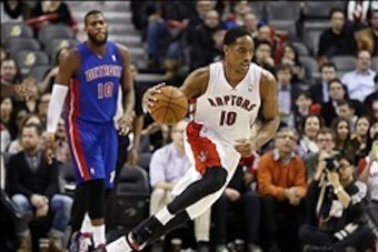 Mar 12, 2014; Toronto, Ontario, CAN; Toronto Raptors guard DeMar DeRozan (10) carries the ball against the Detroit Pistons at the Air Canada Centre. Toronto defeated Detroit 101-87. Mandatory Credit: John E. Sokolowski-USA TODAY Sports