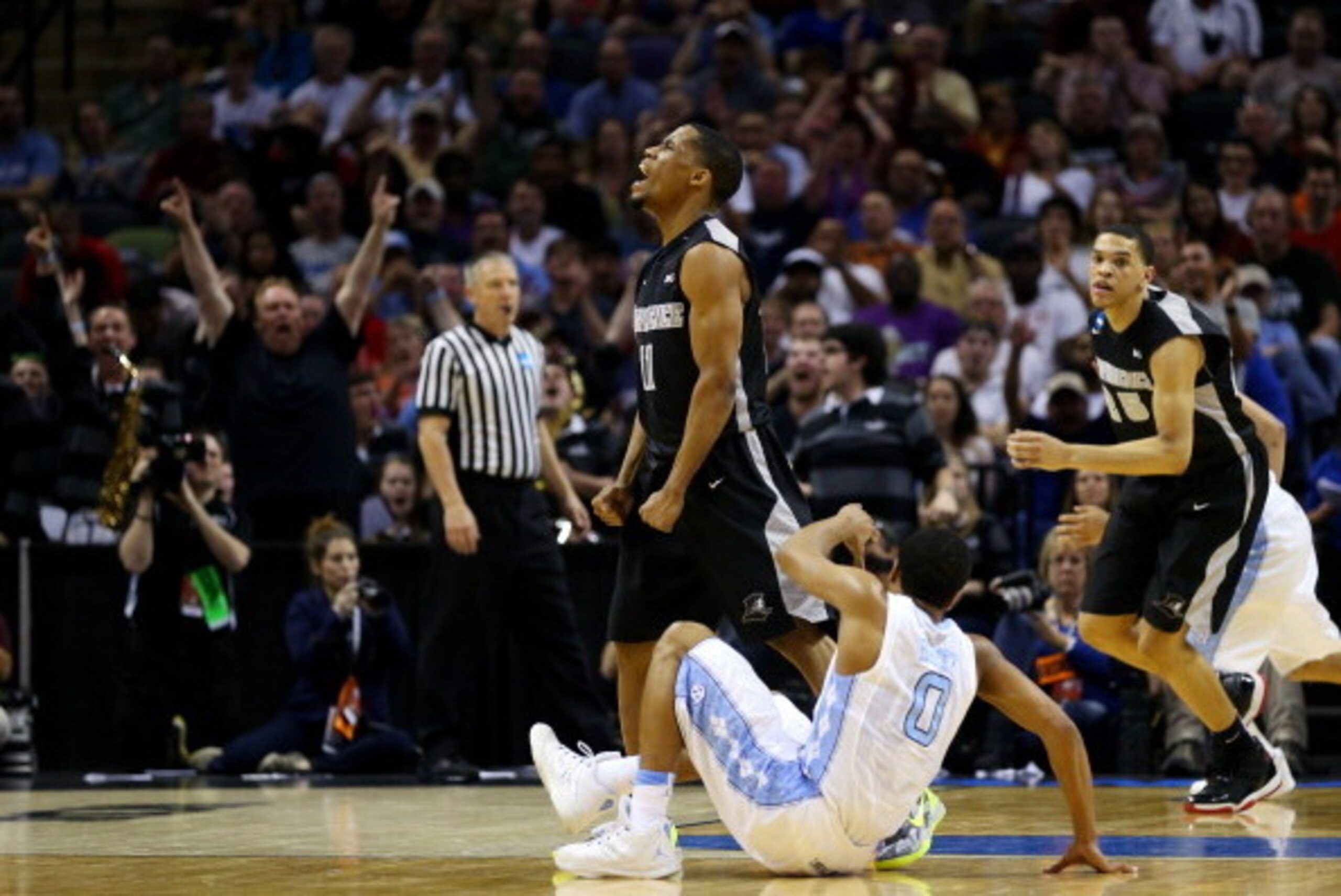 SAN ANTONIO, TX - MARCH 21: Bryce Cotton #11 of the Providence Friars celebrates after hitting a three pointer against the North Carolina Tar Heels during the second half of the second round of the 2014 NCAA Men's Basketball Tournament at AT&T Center on SAN ANTONIO, TX - MARCH 21: Bryce Cotton #11 of the Providence Friars celebrates after hitting a three pointer against the North Carolina Tar Heels during the second half of the second round of the 2014 NCAA Men's Basketball Tournament at AT&T Center on