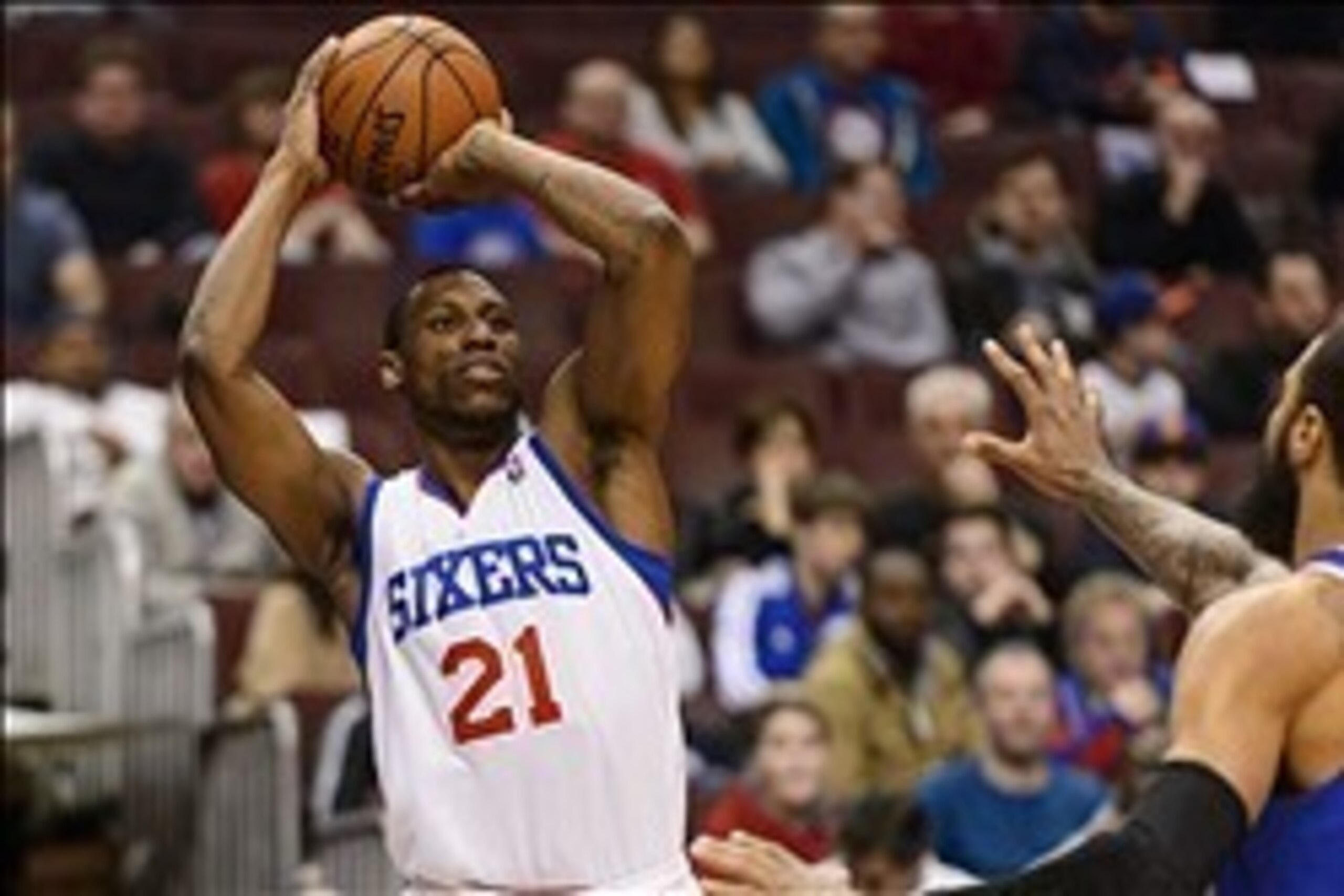 Mar 21, 2014; Philadelphia, PA, USA; Philadelphia 76ers forward Thaddeus Young (21) shoots a jump shot during the first quarter against the New York Knicks at the Wells Fargo Center. Mandatory Credit: Howard Smith-USA TODAY Sports