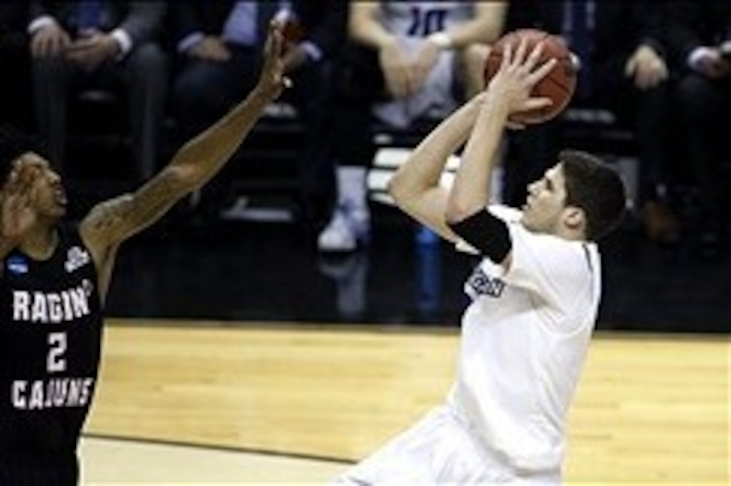 Mar 21, 2014; San Antonio, TX, USA; Louisiana Lafayette Ragin Cajuns guard Elfrid Payton (2) defends against Creighton Bluejays forward Doug McDermott (3) in the second half of a men's college basketball game during the second round of the 2014 NCAA Tourn