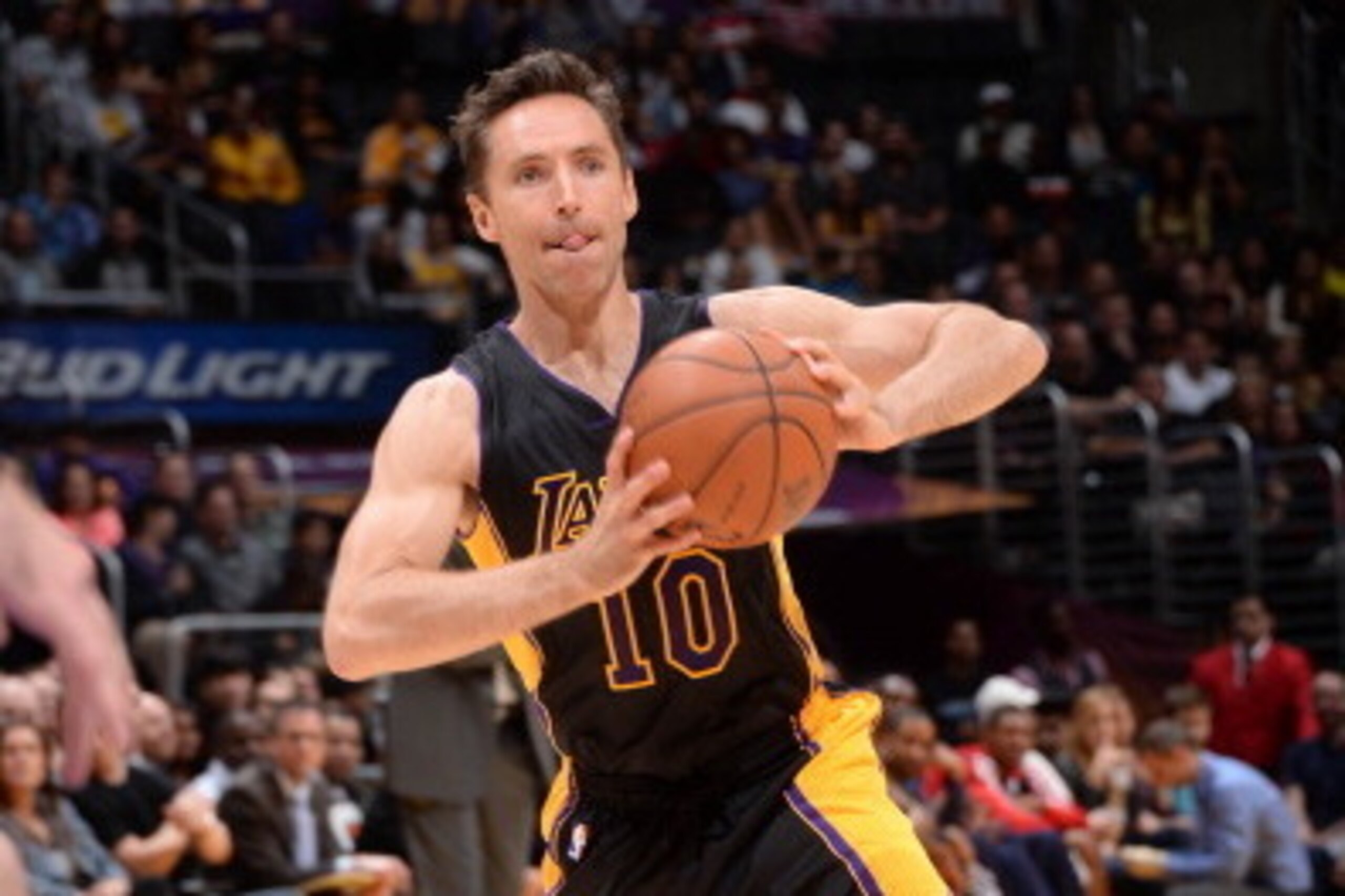 LOS ANGELES, CA - MARCH 21: Steve Nash #10 of the Los Angeles Lakers makes a pass against the Washington Wizards at Staples Center on March 21, 2014 in Los Angeles, California. NOTE TO USER: User expressly acknowledges and agrees that, by downloading and/