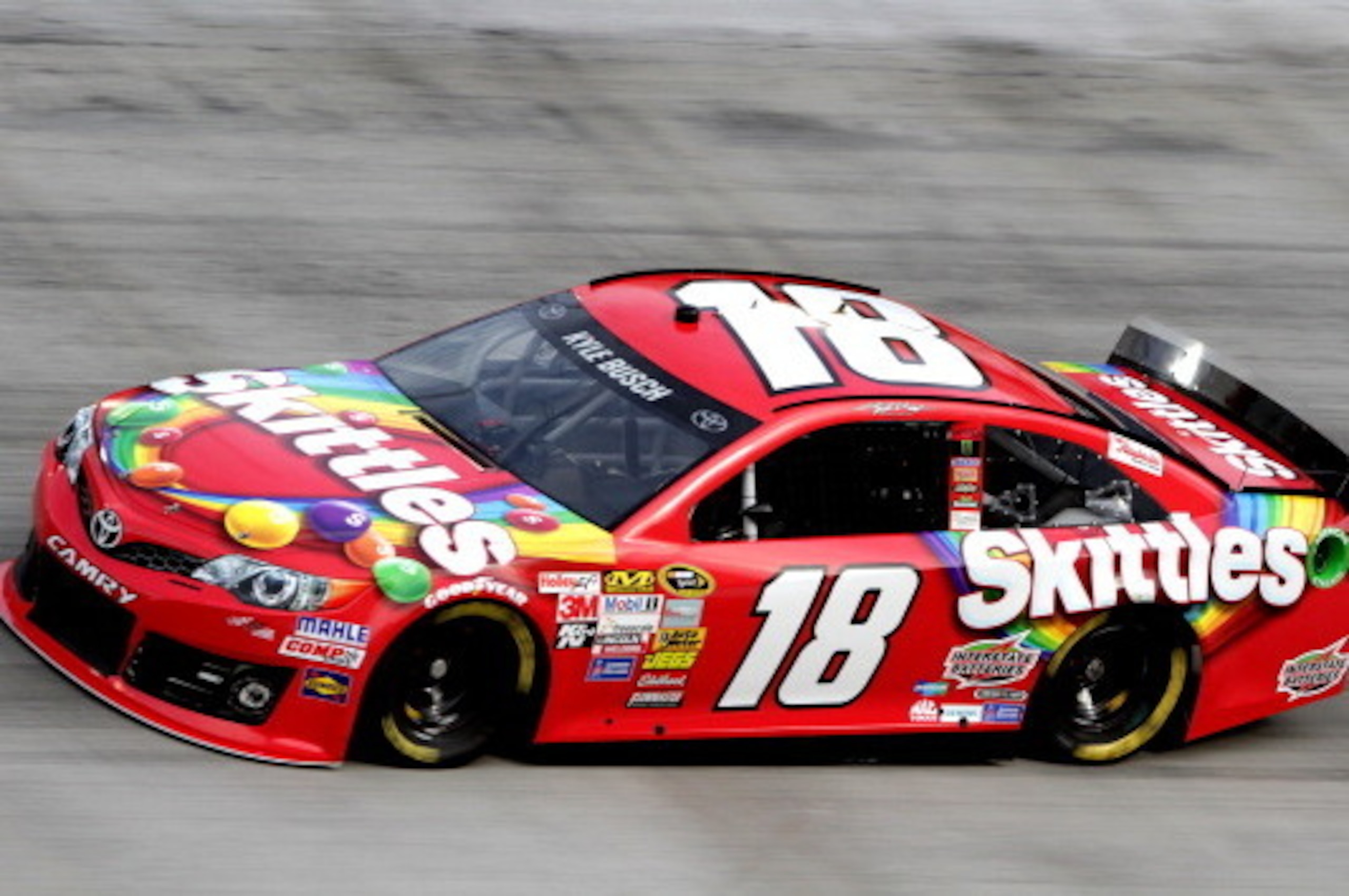 BRISTOL, TN - MARCH 14: Kyle Busch drives the #18 Skittles Toyota during qualifying for the NASCAR Sprint Cup Series Food City 500 at Bristol Motor Speedway on March 14, 2014 in Bristol, Tennessee.  (Photo by Jerry Markland/Getty Images)
