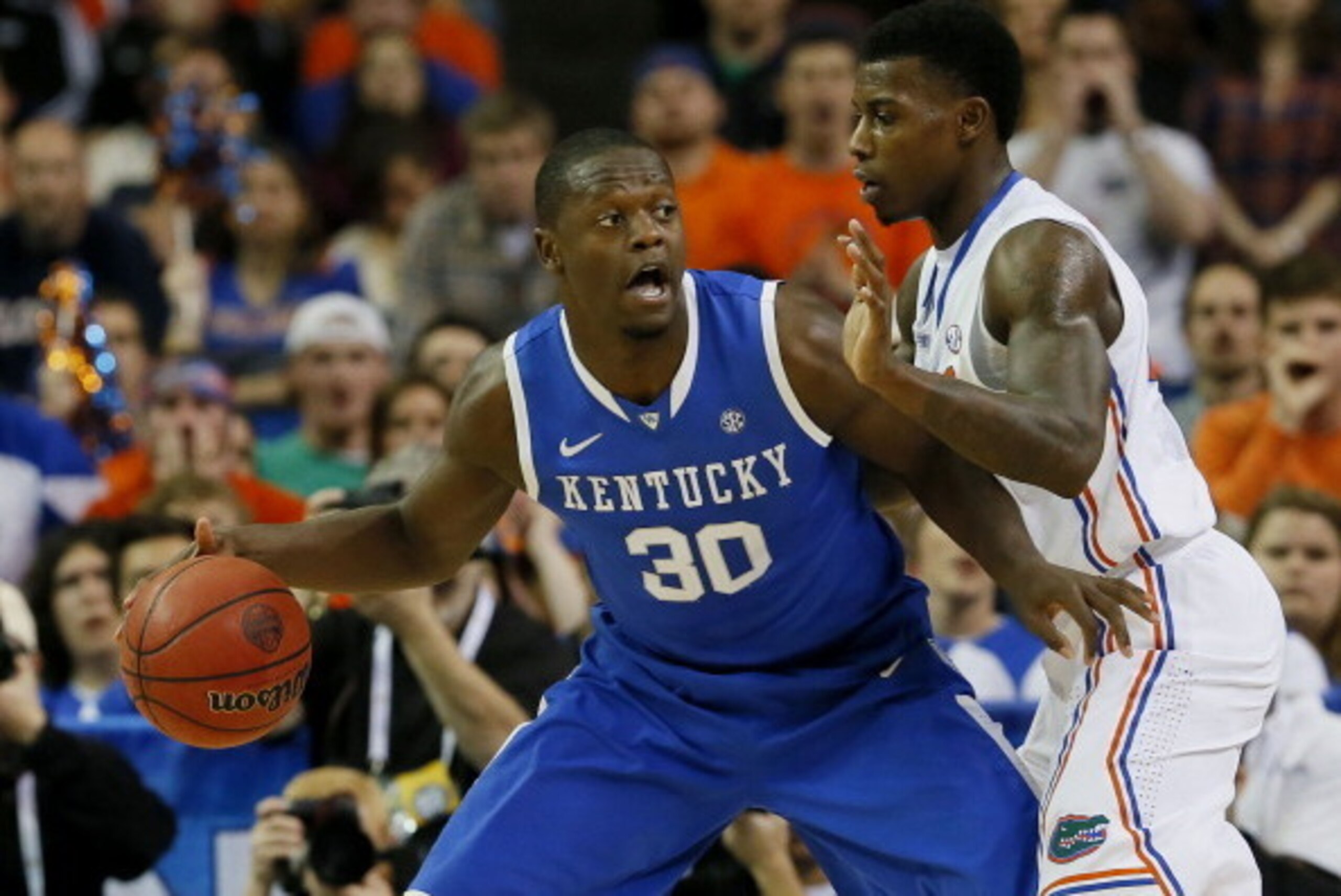 ATLANTA, GA - MARCH 16:  Julius Randle #30 of the Kentucky Wildcats drives against Casey Prather #24 of the Florida Gators in the first half during the Championship game of the 2014 Men's SEC Basketball Tournament at Georgia Dome on March 16, 2014 in Atla