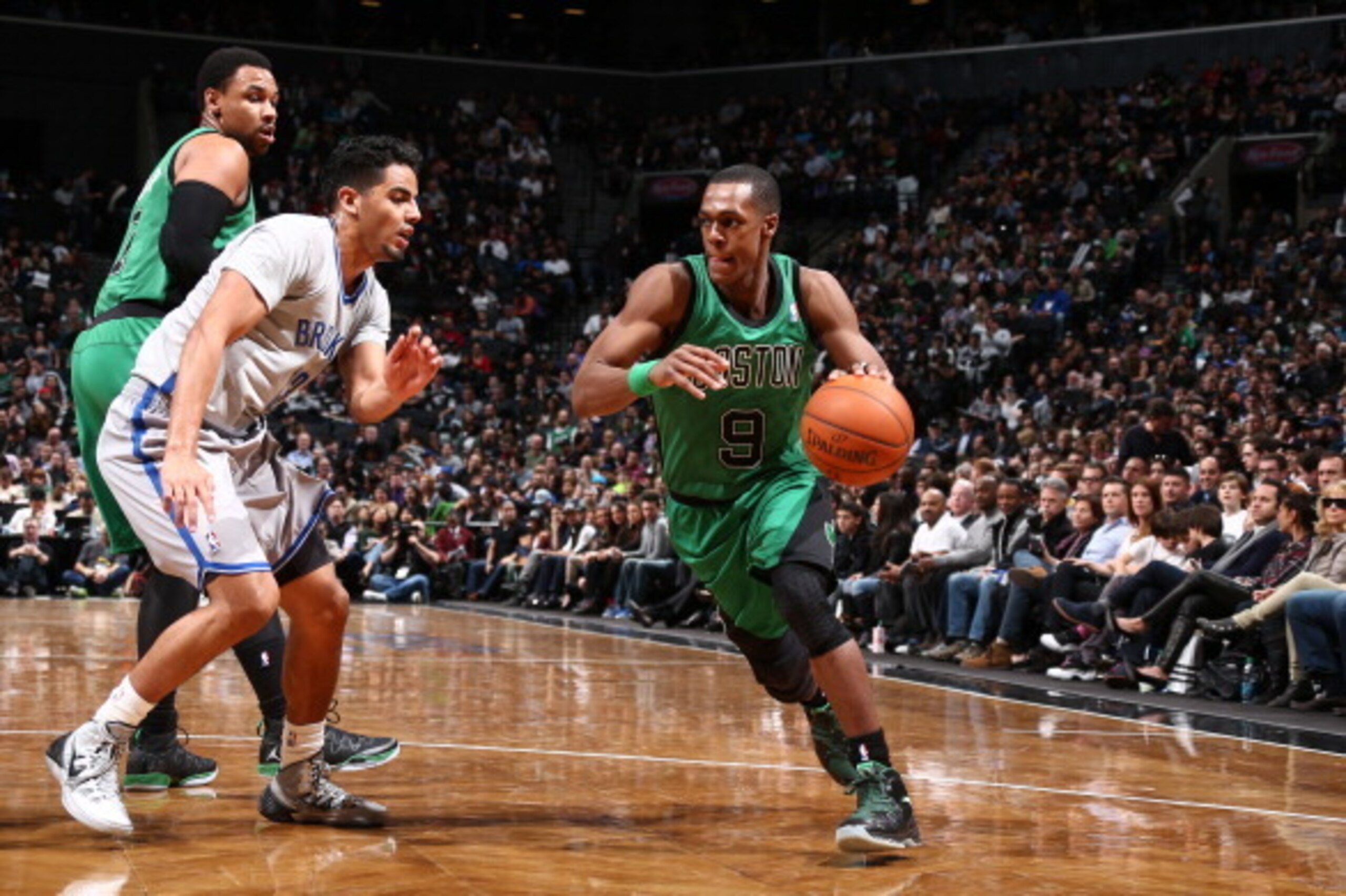BROOKLYN, NY - MARCH 21: Rajon Rondo #9 of the Boston Celtics drives against Jorge Gutierrez #13 of the Brooklyn Nets during a game at the Barclays Center on March 21, 2014 in the Brooklyn borough of New York City.  NOTE TO USER: User expressly acknowledg