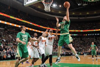 BOSTON, MA - MARCH 14: Kelly Olynyk #41 of the Boston Celtics shoots against the Phoenix Suns on March 14, 2014 at the TD Garden in Boston, Massachusetts.  NOTE TO USER: User expressly acknowledges and agrees that, by downloading and or using this photogr