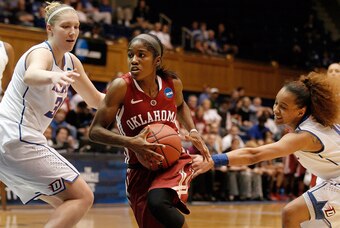 Mar 22, 2014; Durham, NC, USA; Oklahoma Sooners guard Aaryn Ellenberg (3) dribbles the ball as DePaul Blue Demons guard/forward Megan Podkowa (30) defends in the first half of a women's college basketball game in the first round of the NCAA Tournament at